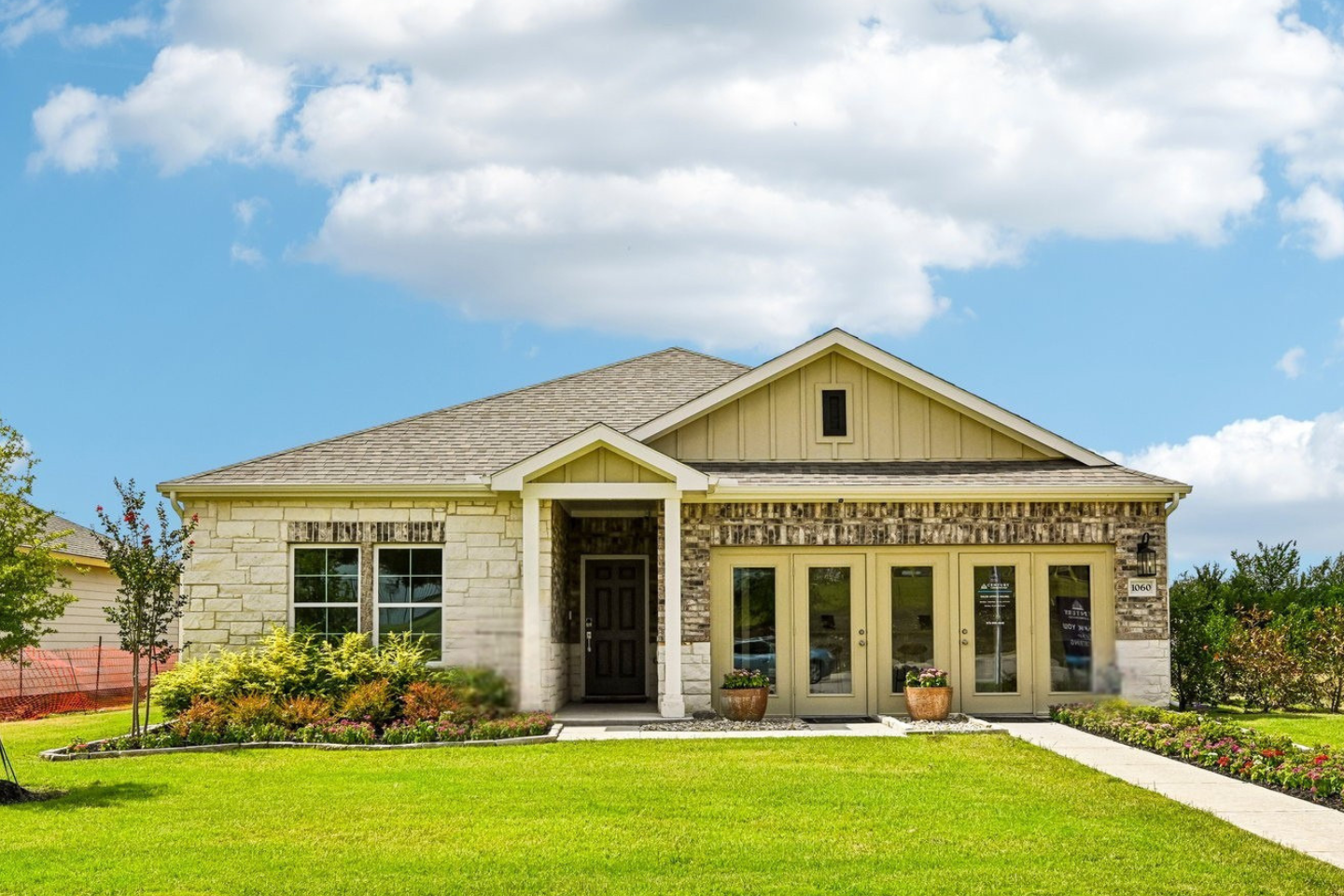 A house with a large front yard.