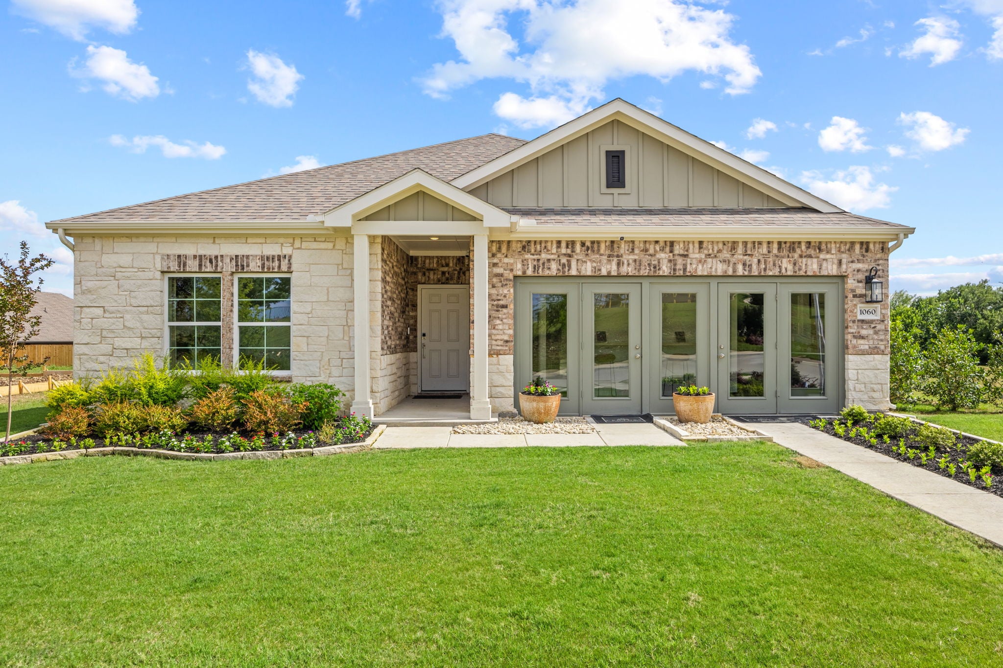 A house with a lawn and a large front yard.
