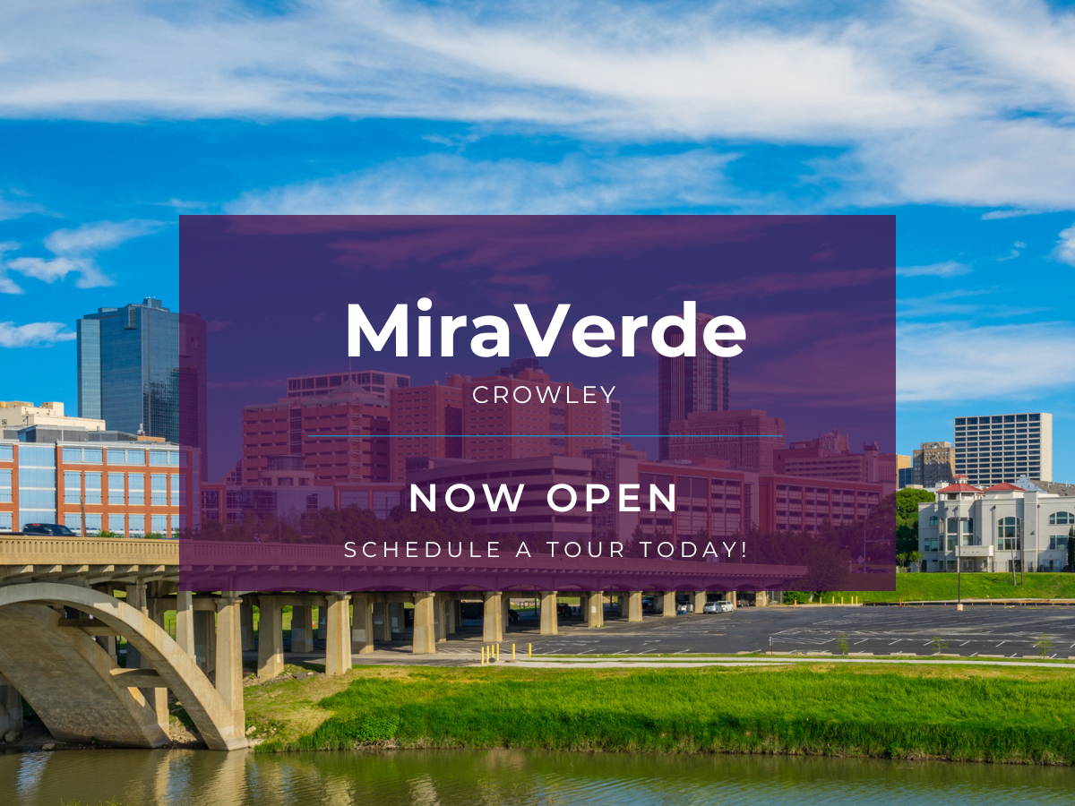 A large building with a bridge over a river.