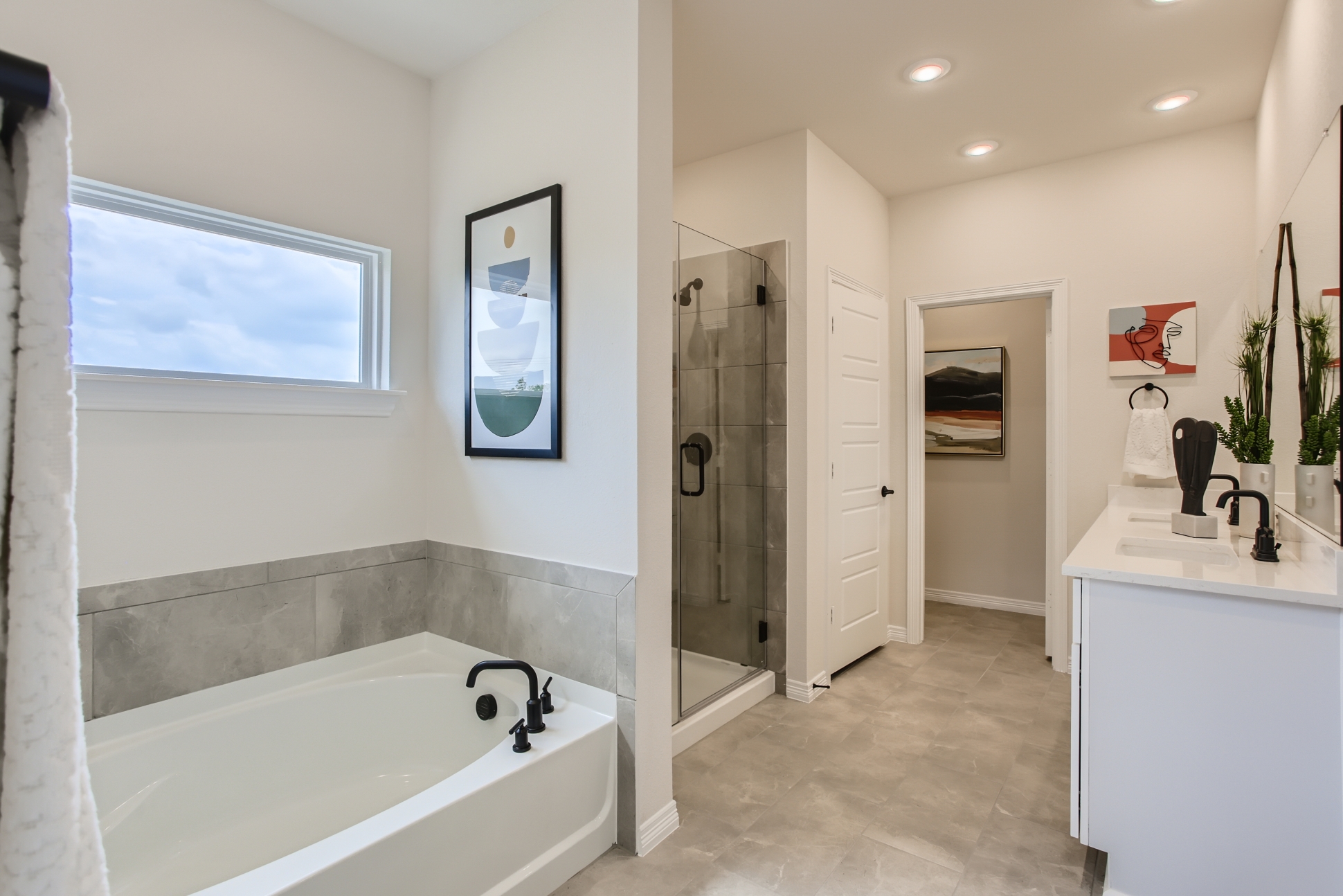 A bathroom with a tub and sink.