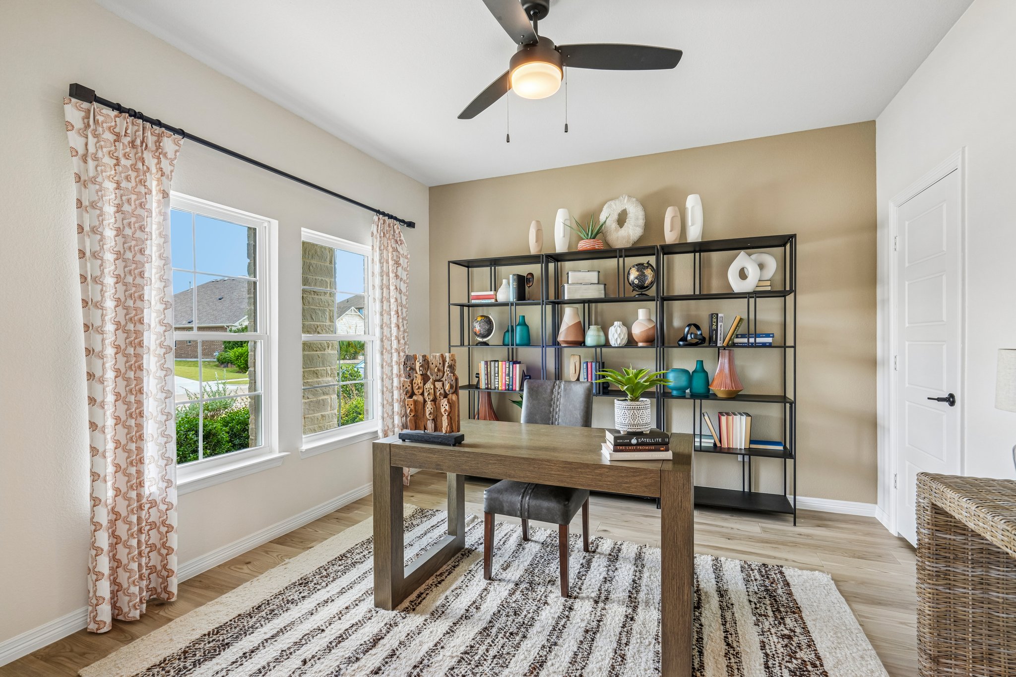 A room with a table and shelves.