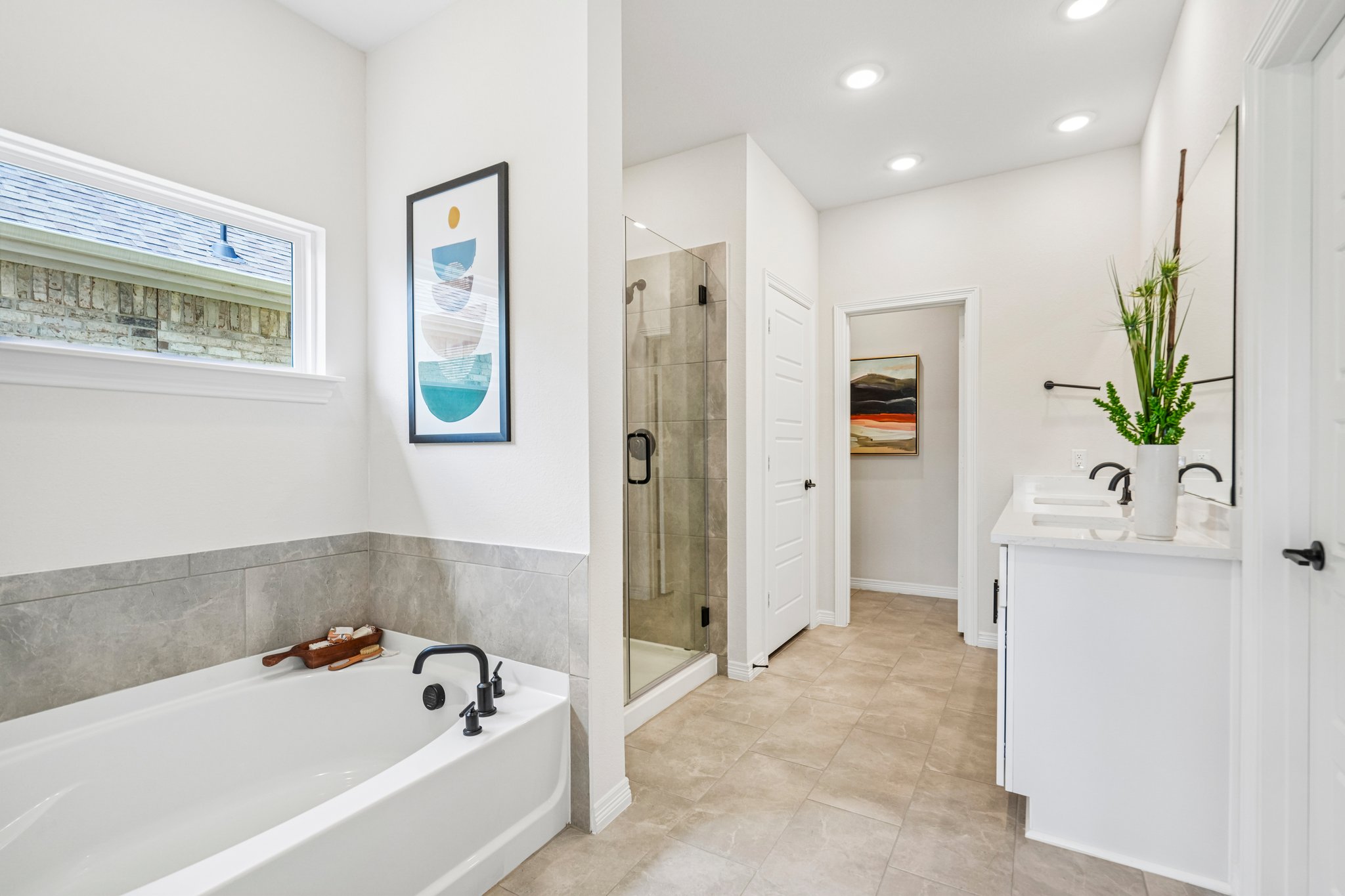 A bathroom with a tub and sink.