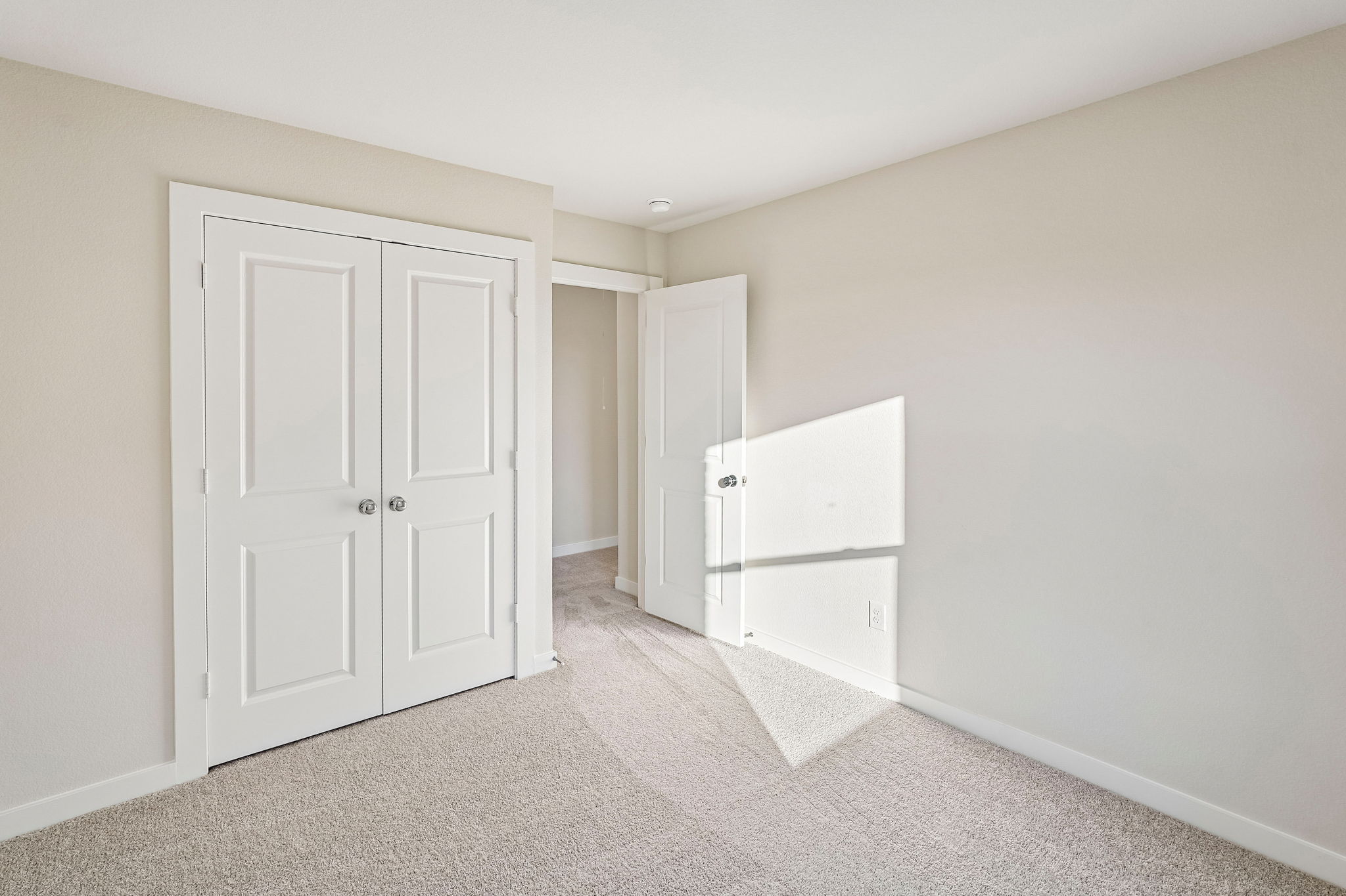 A room with white doors.
