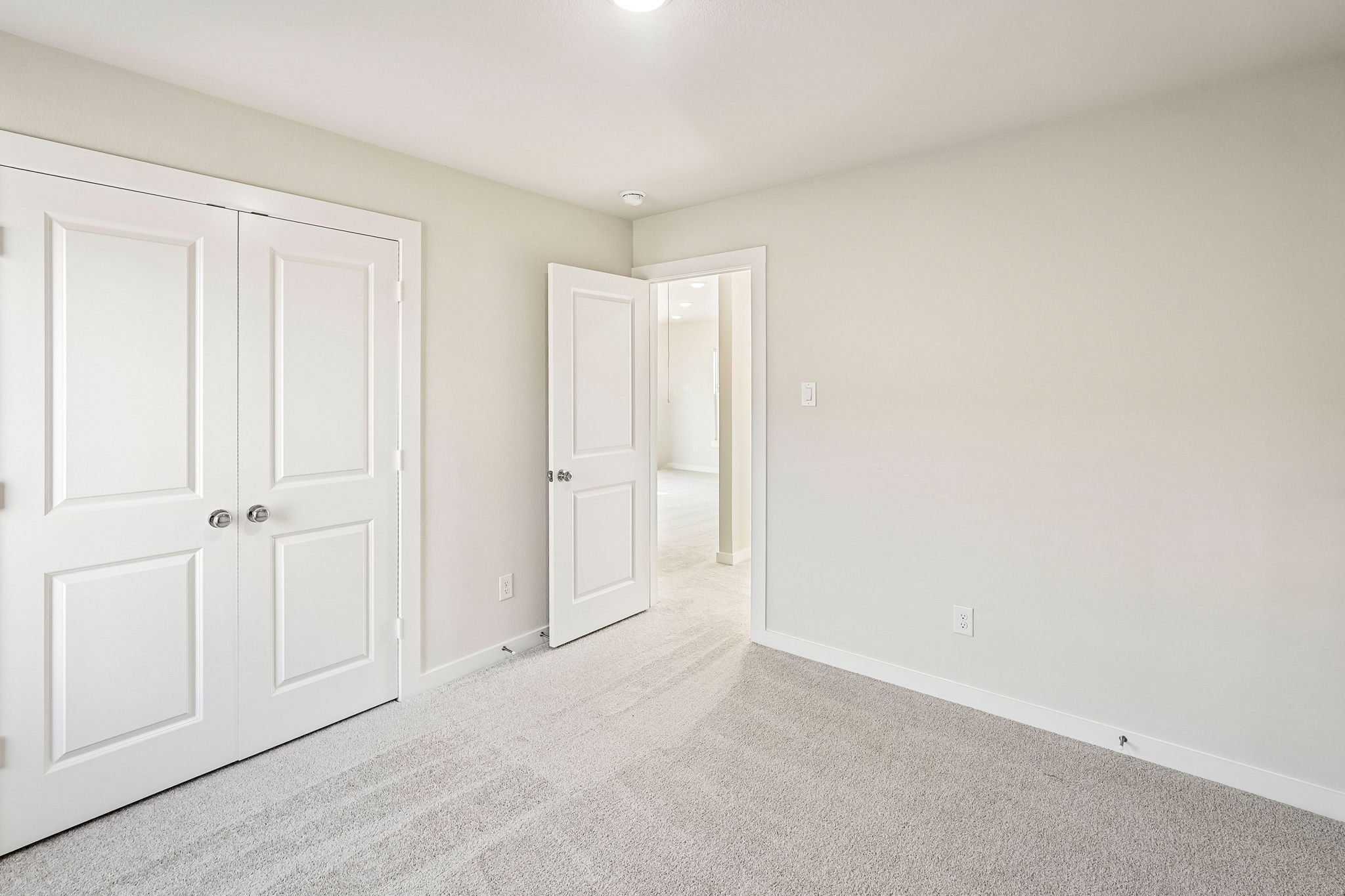 A room with white doors.