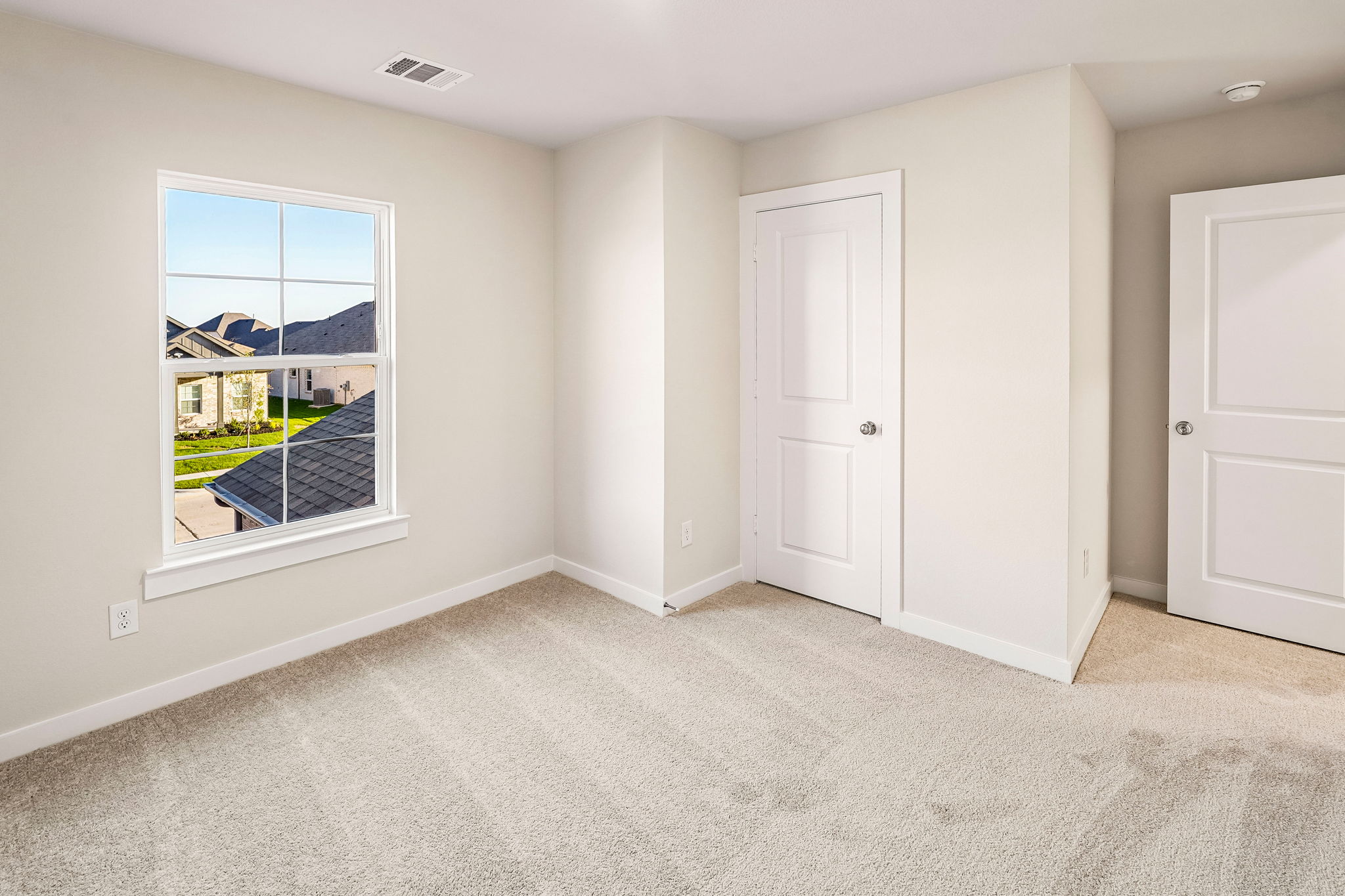A room with white doors.