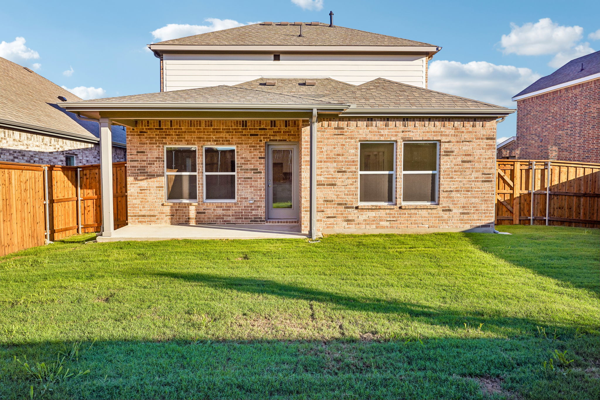A house with a grass yard.