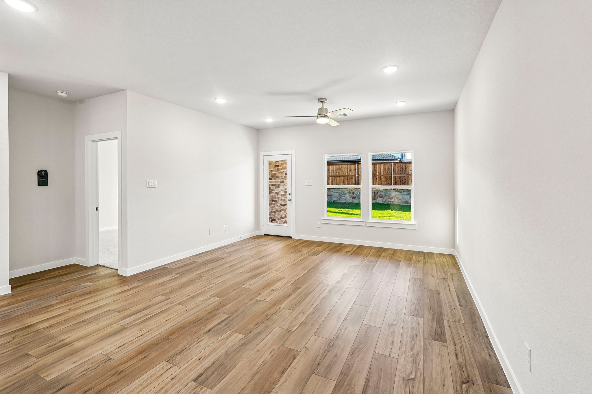 A room with a wood floor and a wood floor with a wood floor.