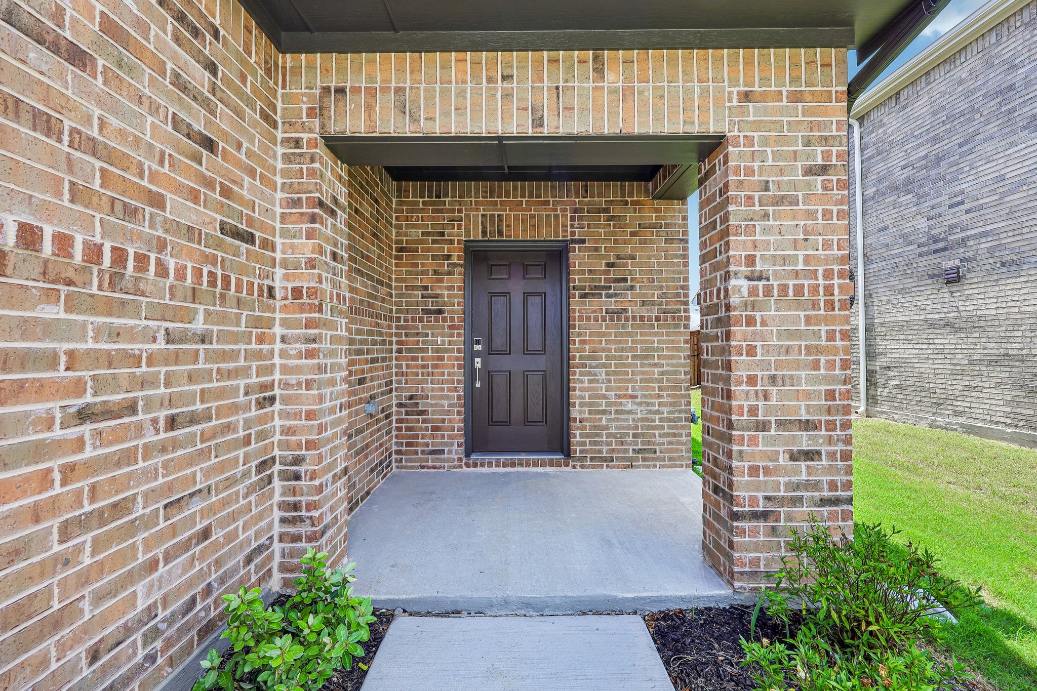 A brick building with a door.
