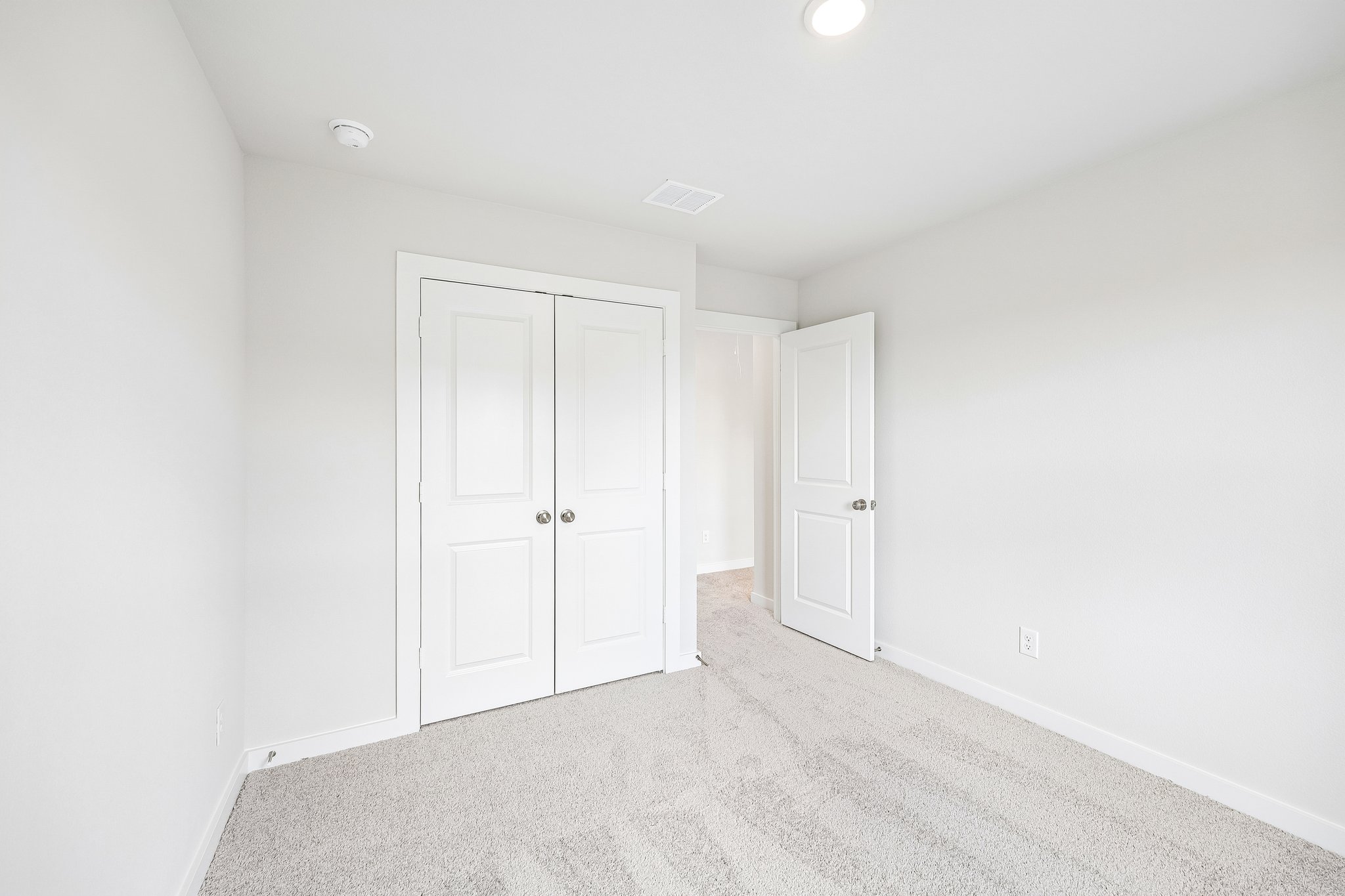 A room with white doors.