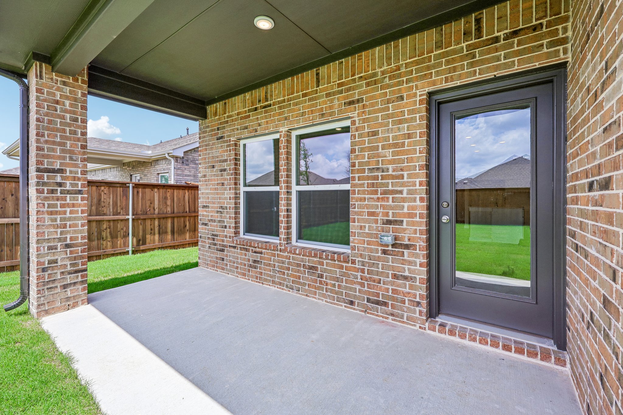 A brick building with a walkway.