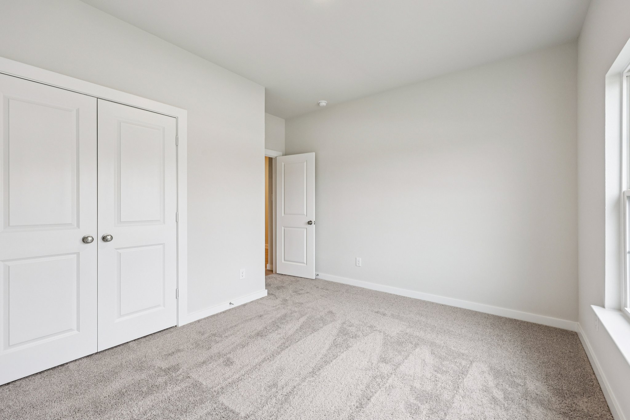 A room with white doors.