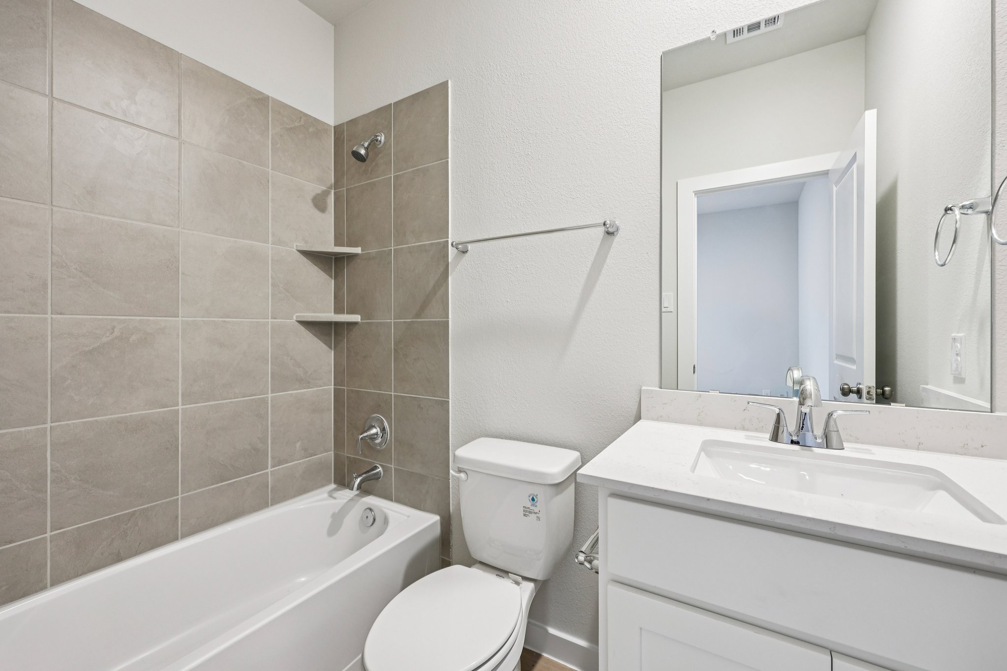 A bathroom with a toilet and sink.