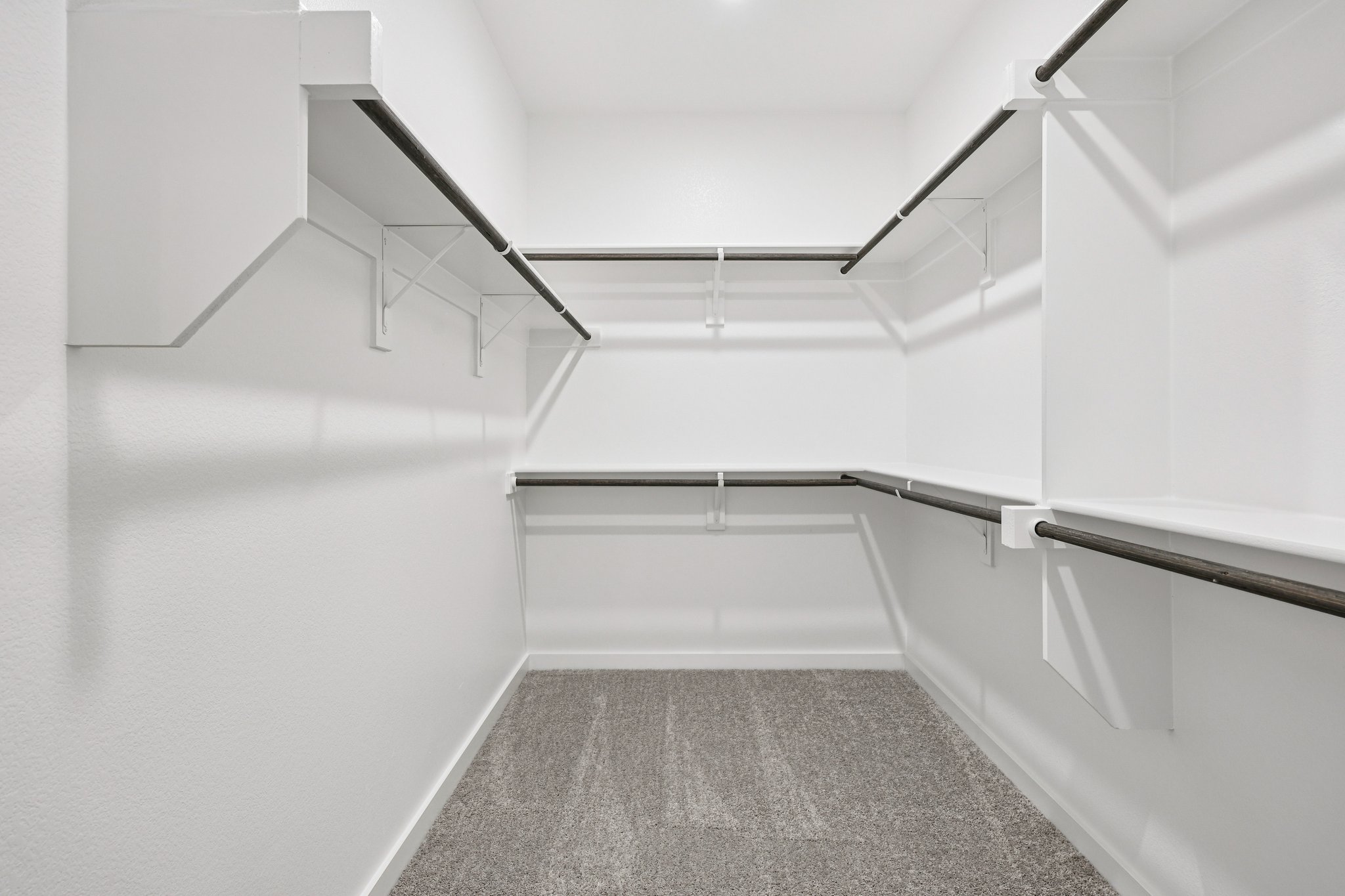 A white room with a staircase.