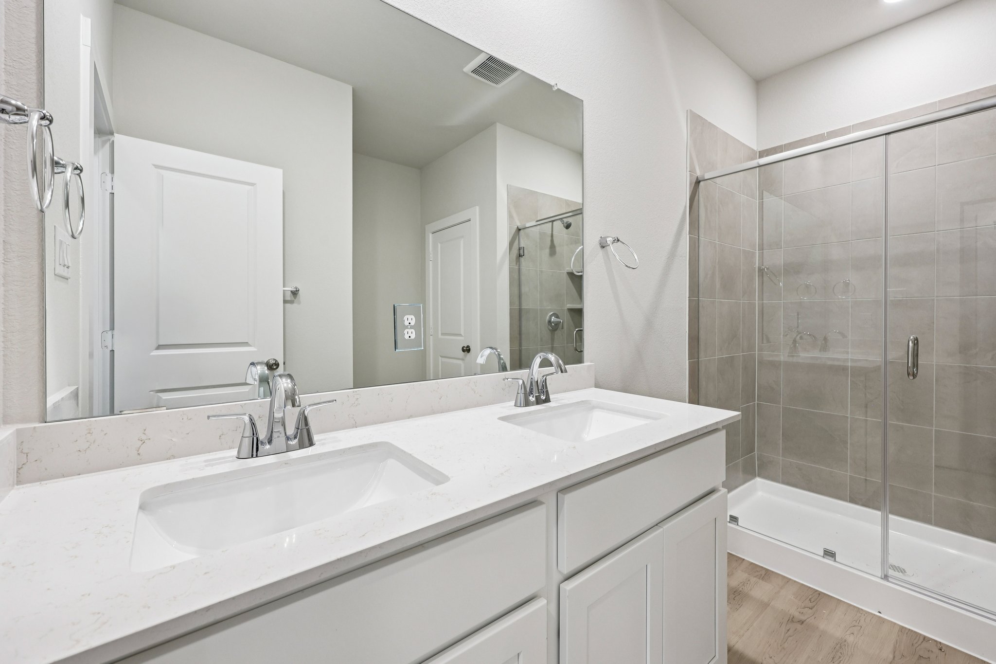 A bathroom with a glass shower.