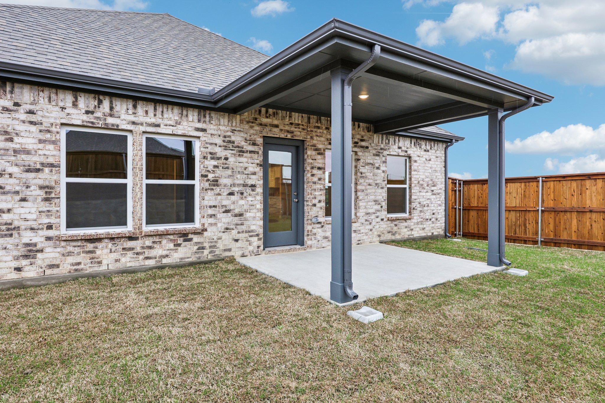 A house with a fence and a yard.