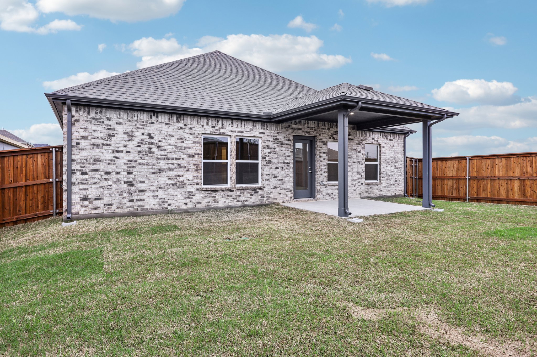 A house with a grass yard.