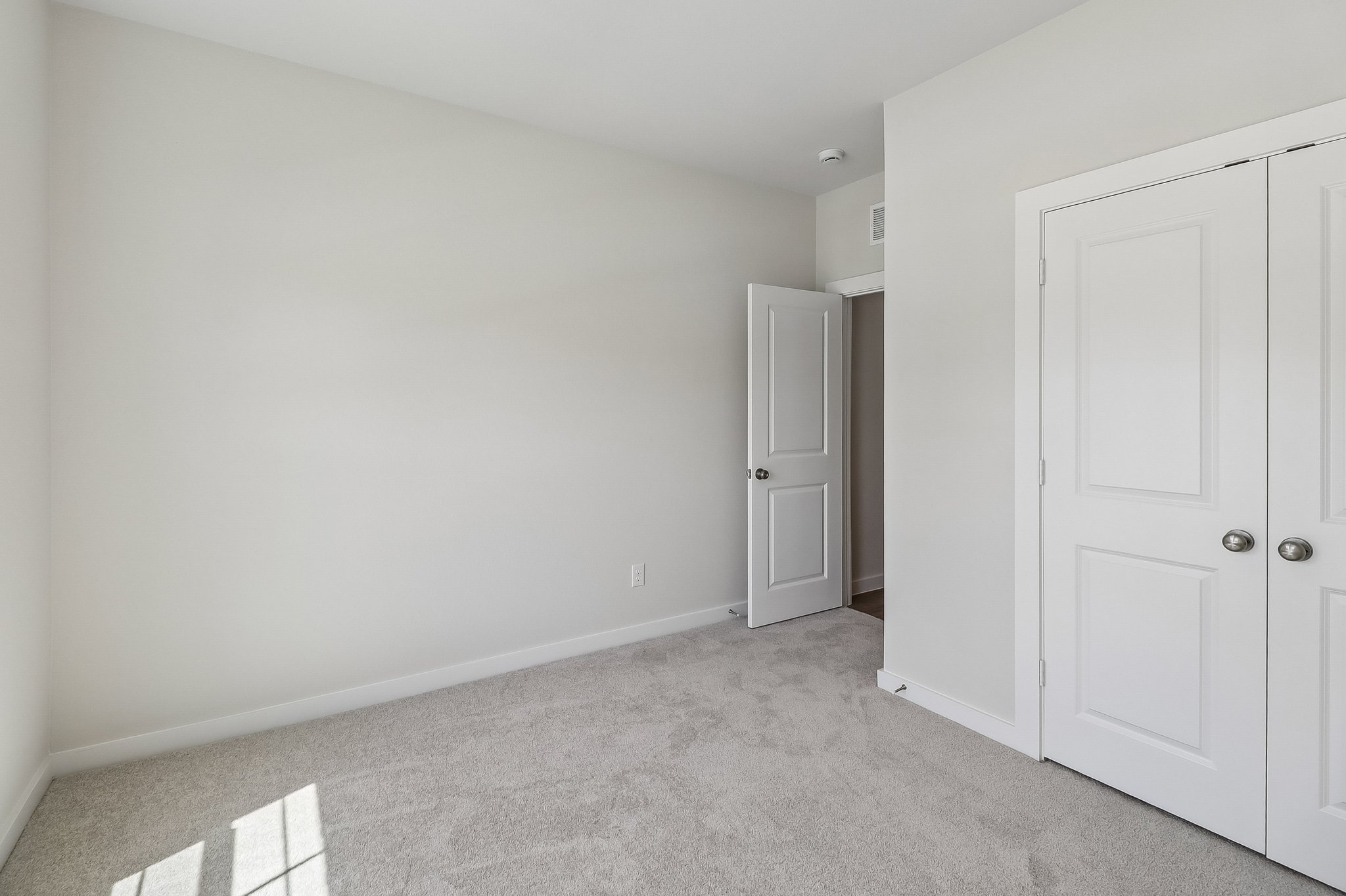 A room with white doors.