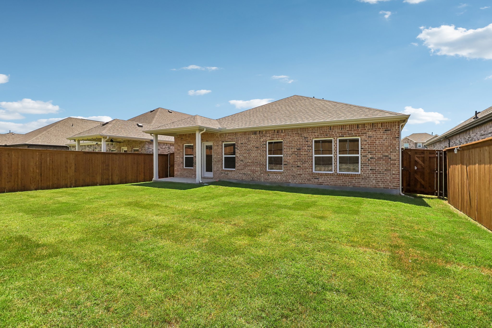 A house with a grass yard.