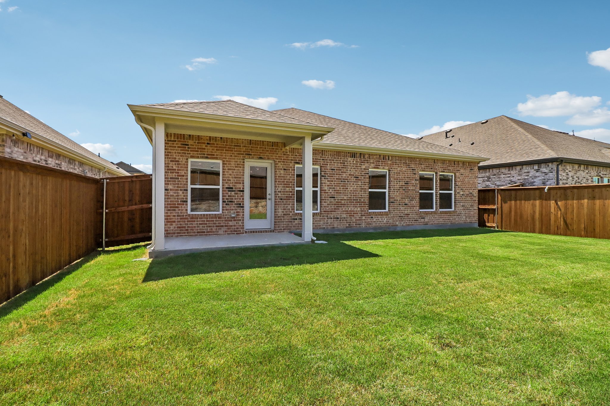 A house with a grass yard.