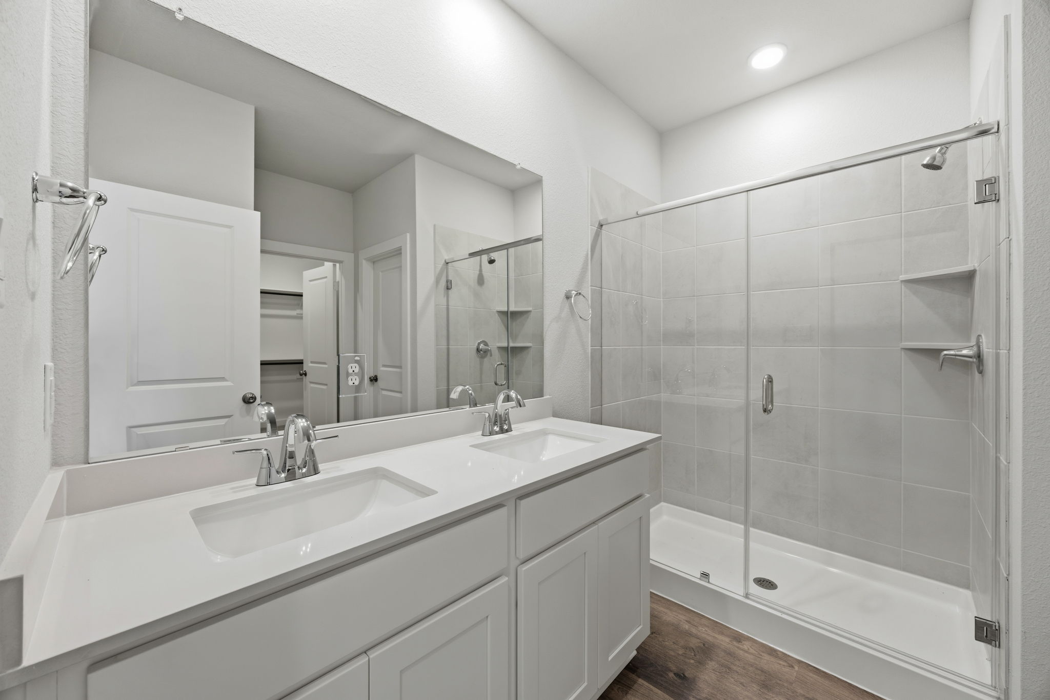 A bathroom with a glass shower.