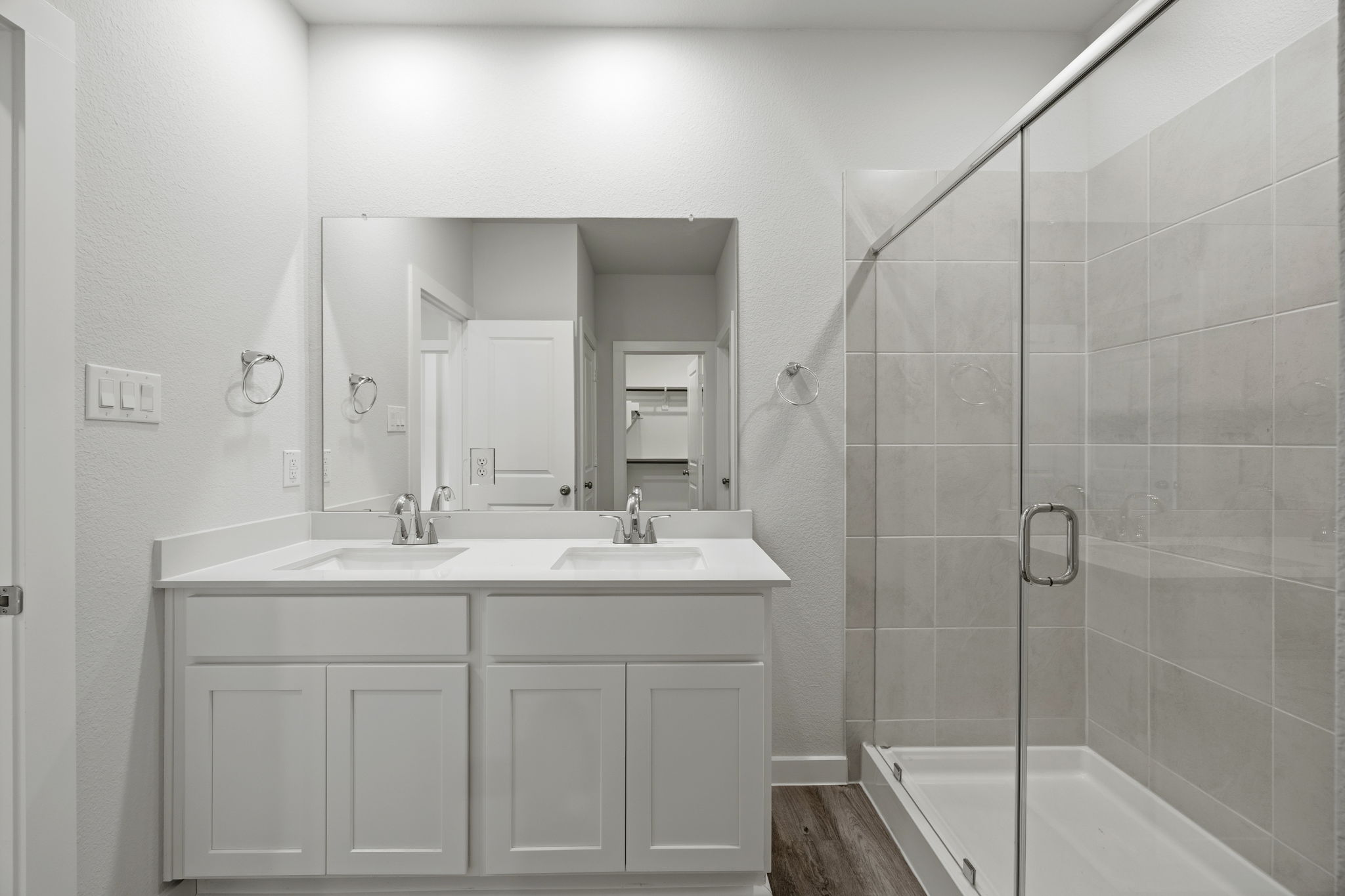 A bathroom with a glass shower.