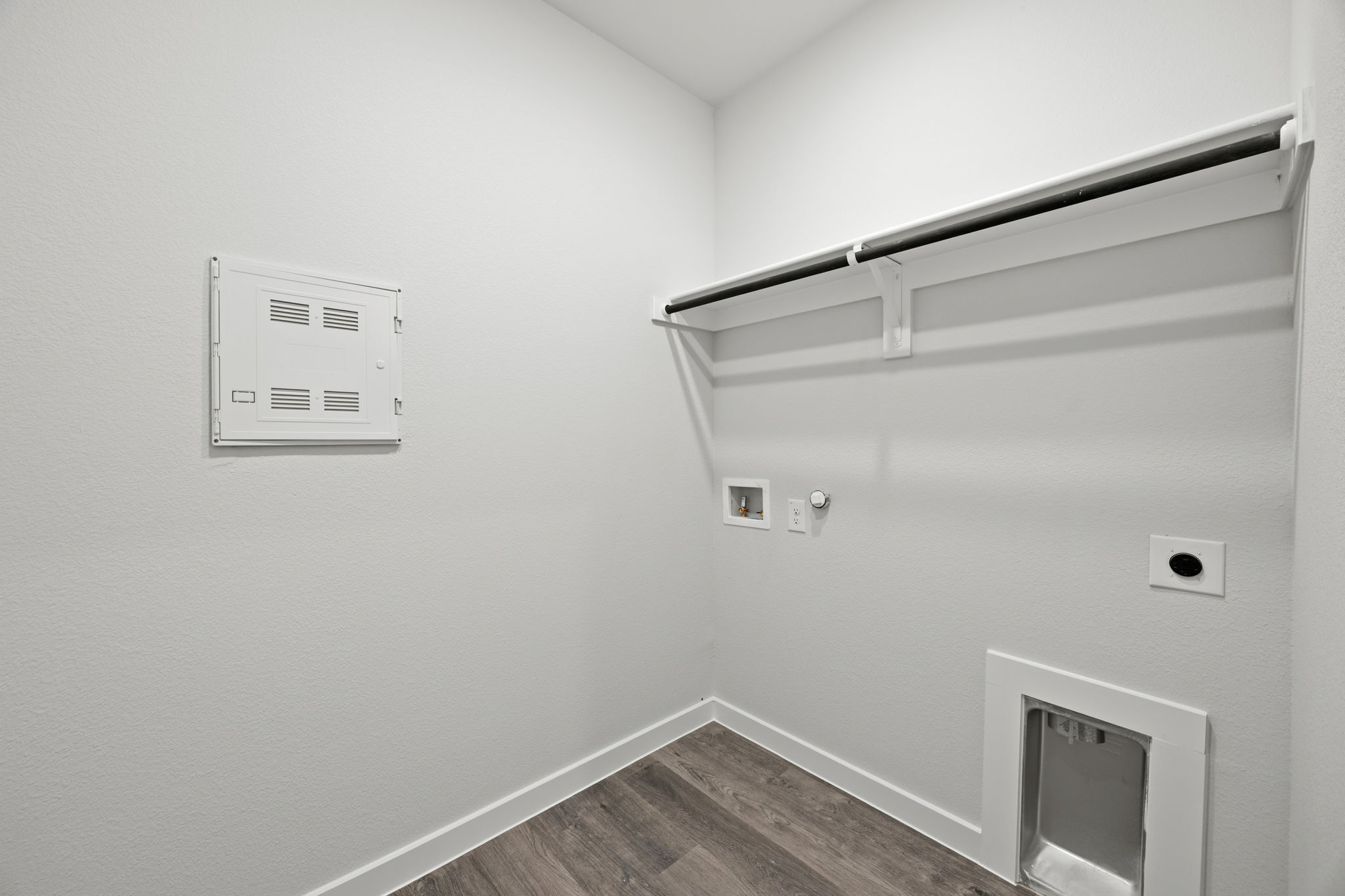 A white wall with a light on it.