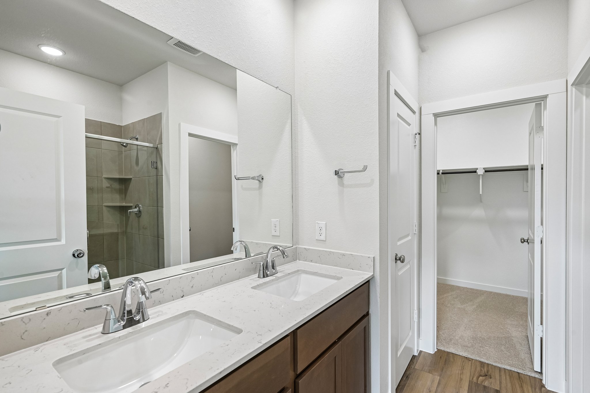 A bathroom with a glass shower.