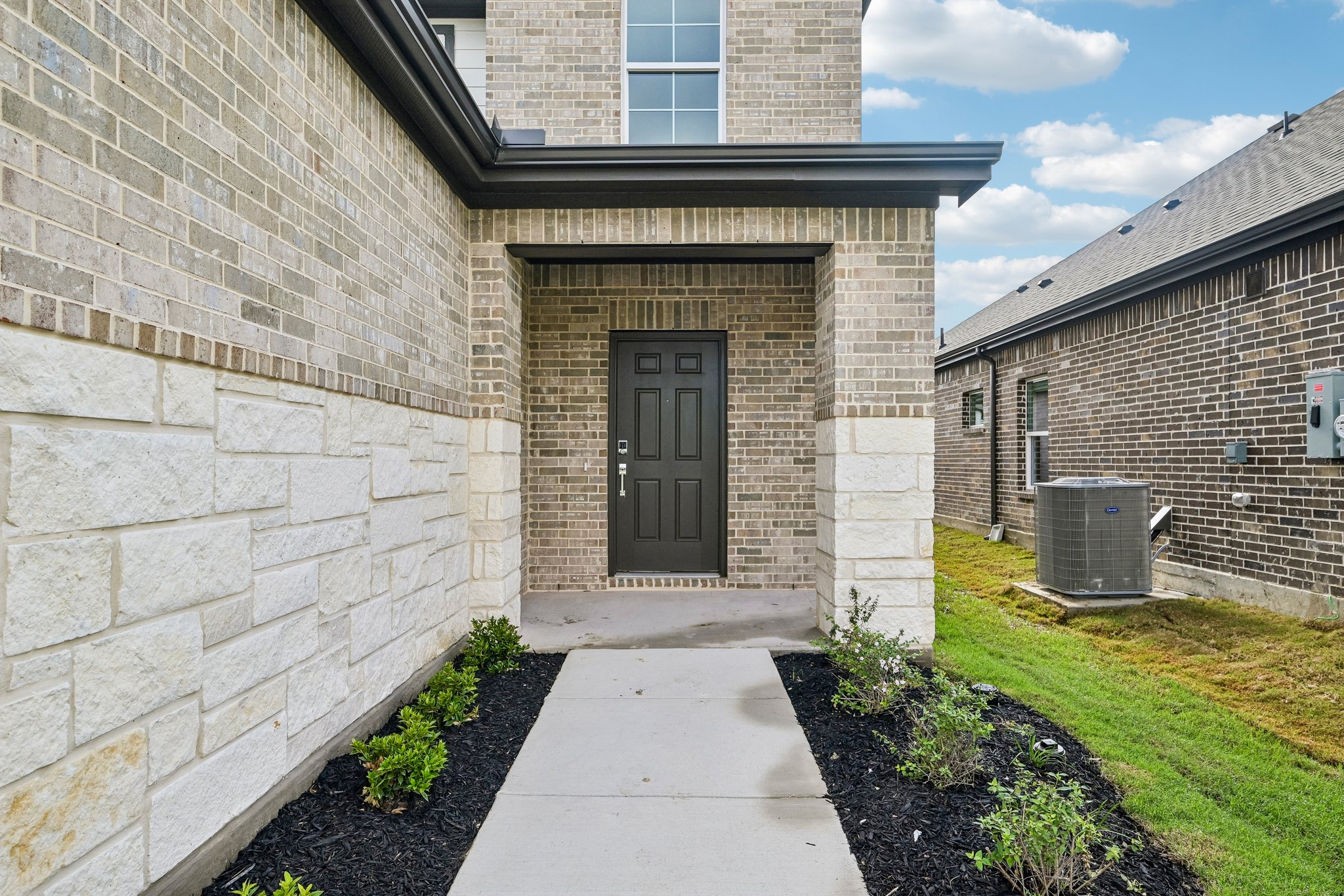 A stone building with a door.