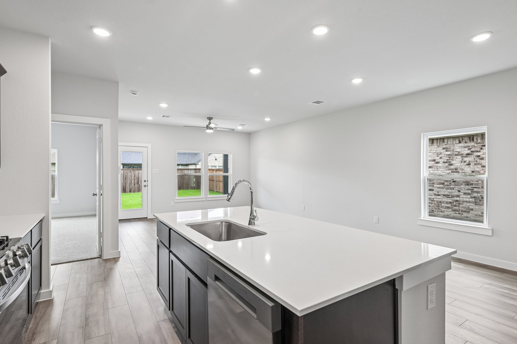 A kitchen with a sink and a counter top.