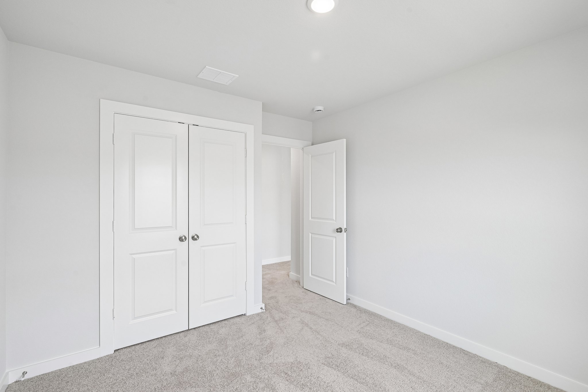 A room with white doors.