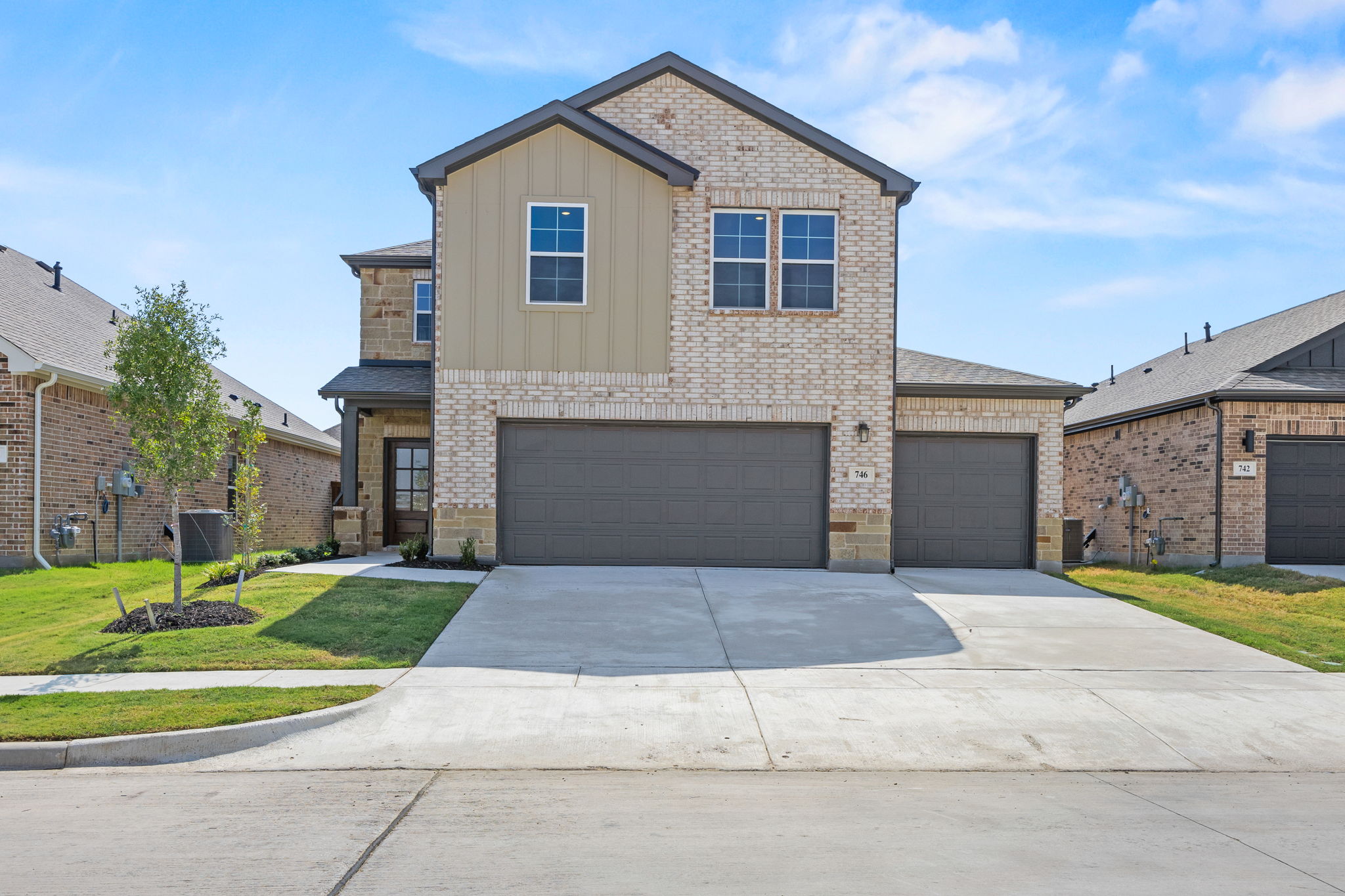 A large house with a driveway.