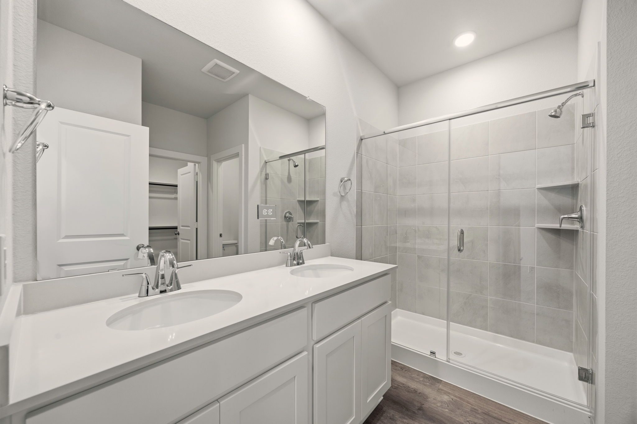 A bathroom with a glass shower.