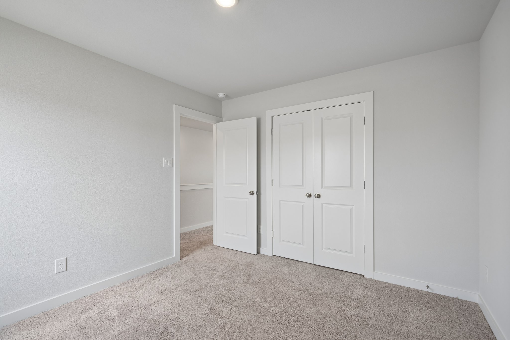 A room with white doors.