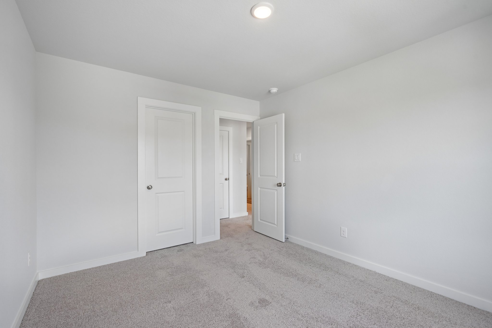A room with white doors.