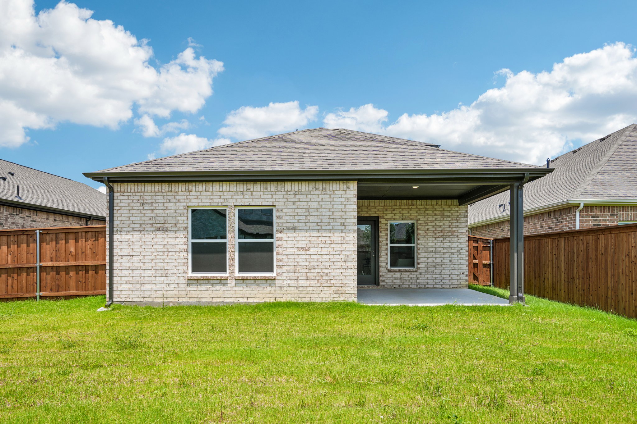 A house with a grass yard.