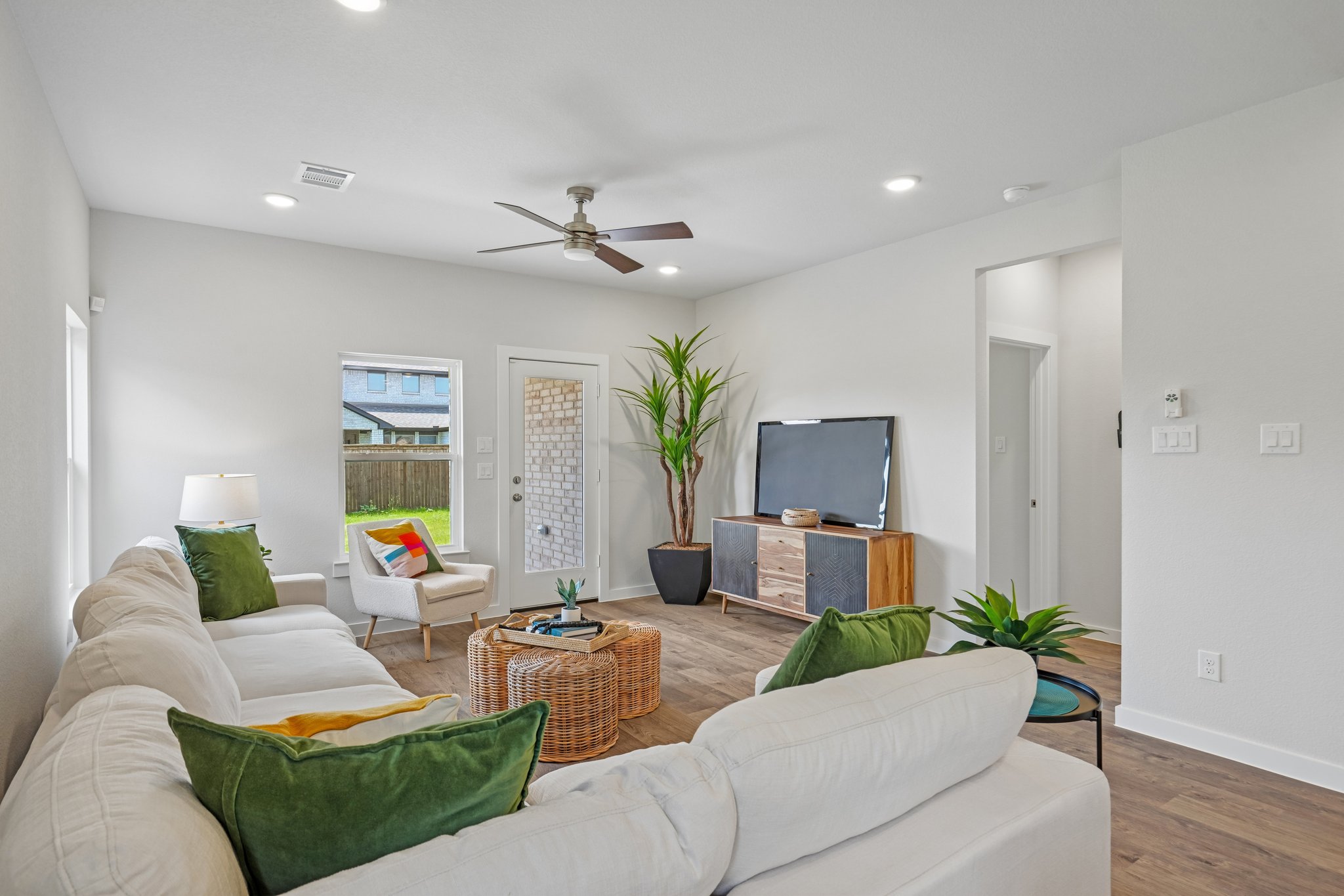 A living room with a tv and couches.