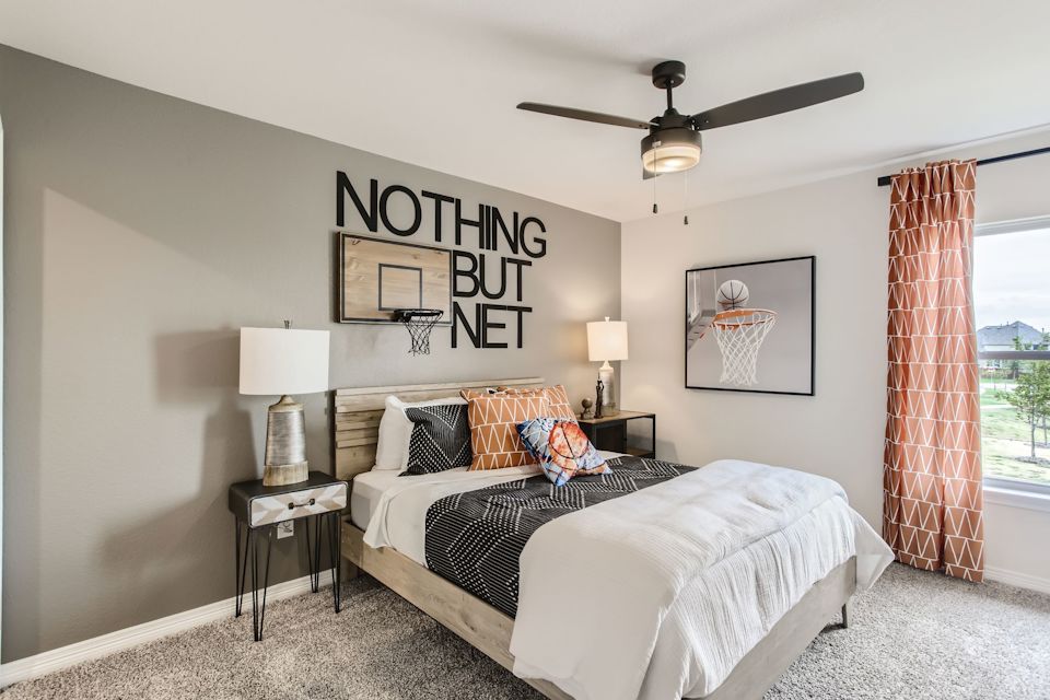 A bedroom with two beds.