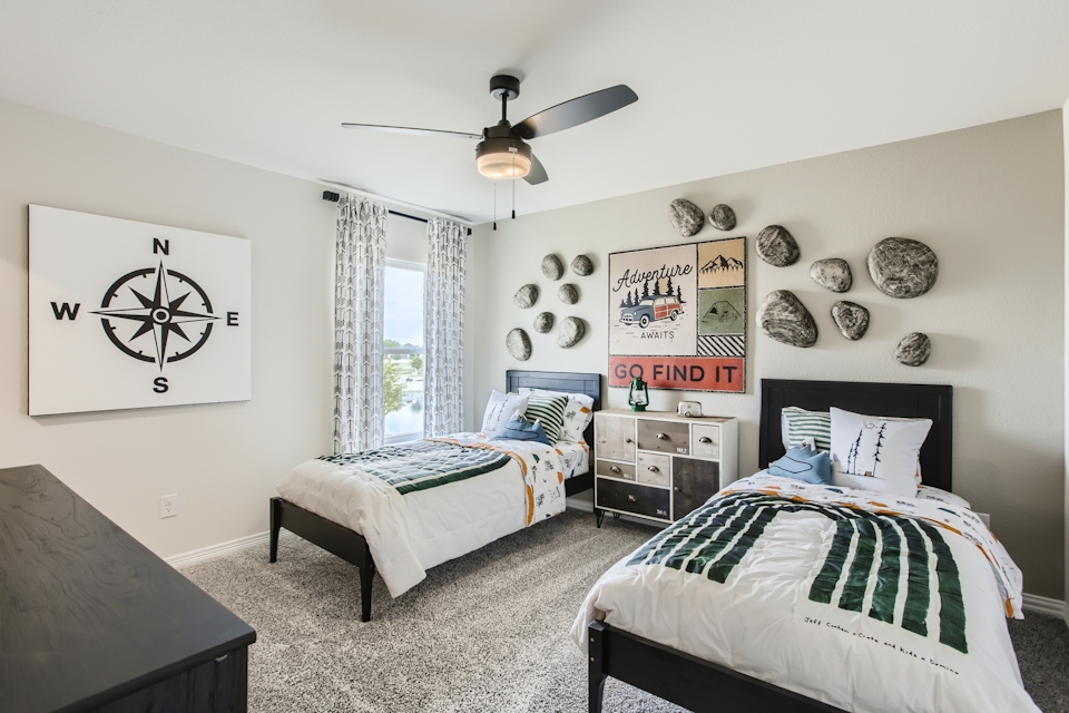 A bedroom with two beds.