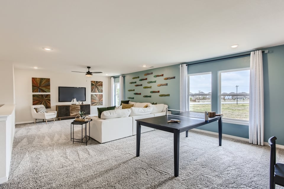 A living room with a large window.