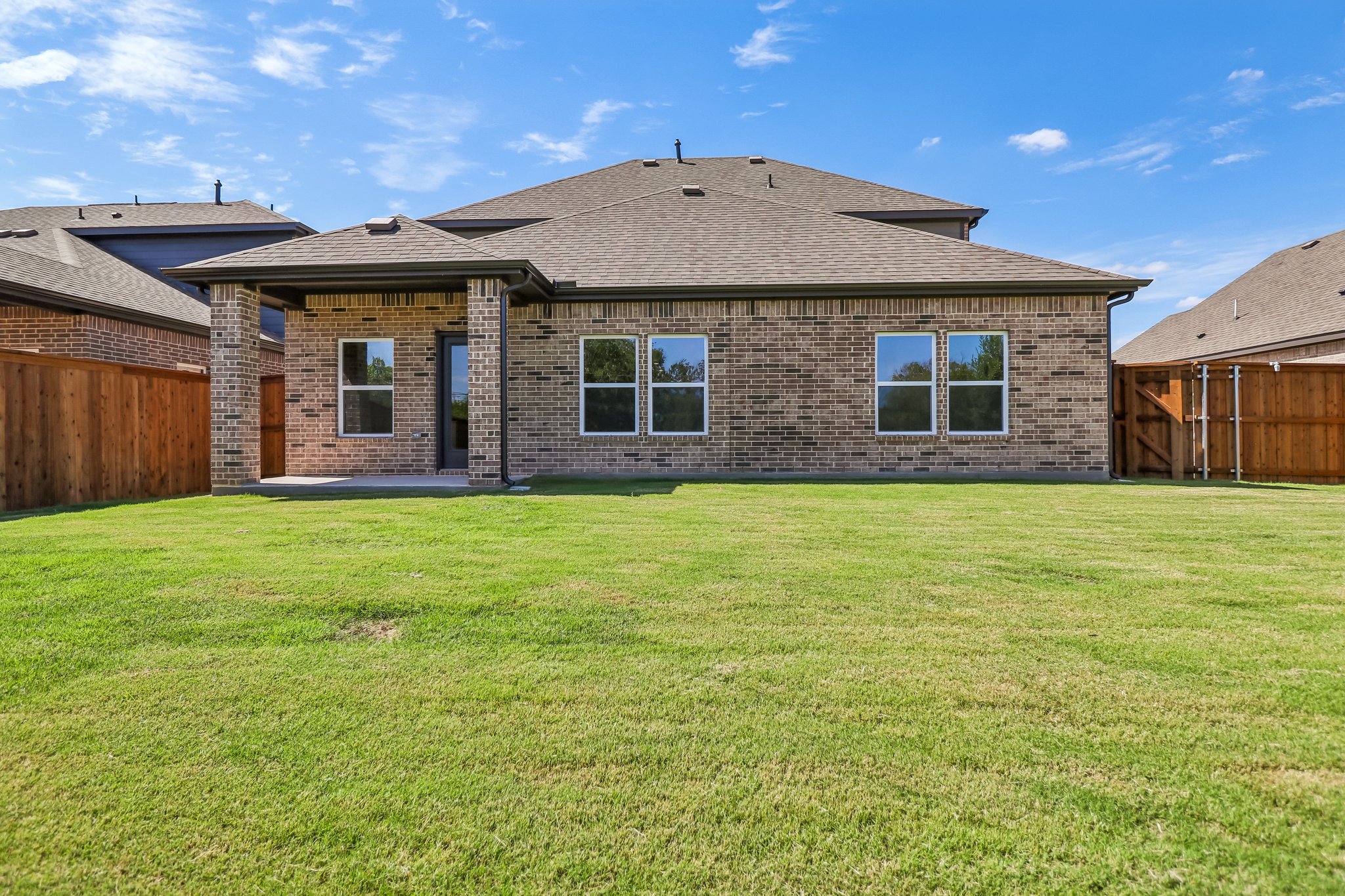 A house with a grass yard.