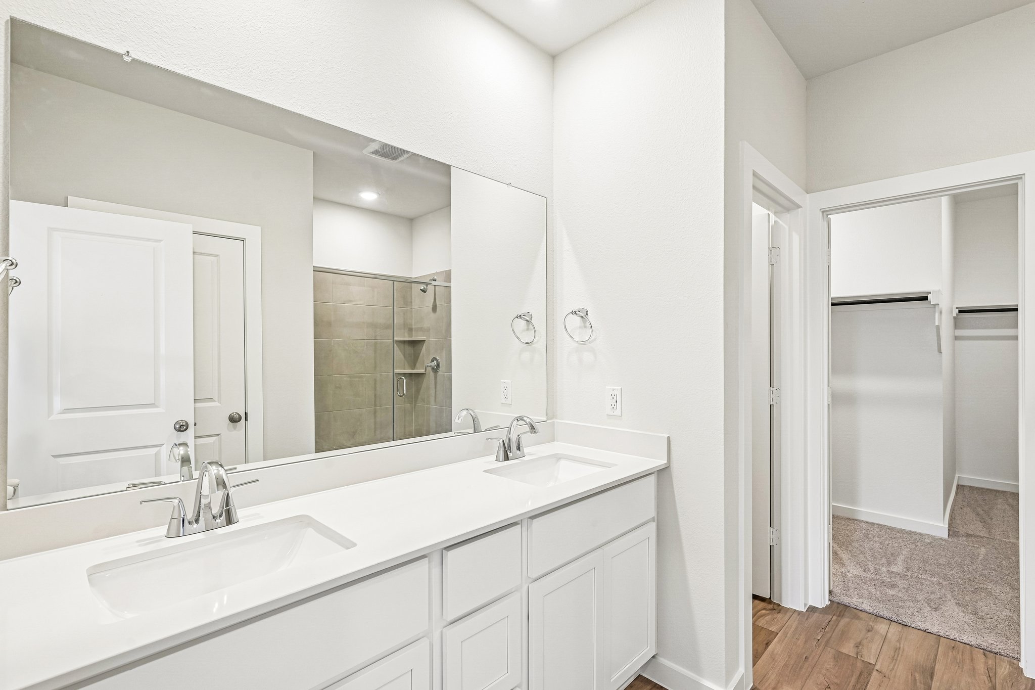 A bathroom with a glass shower.