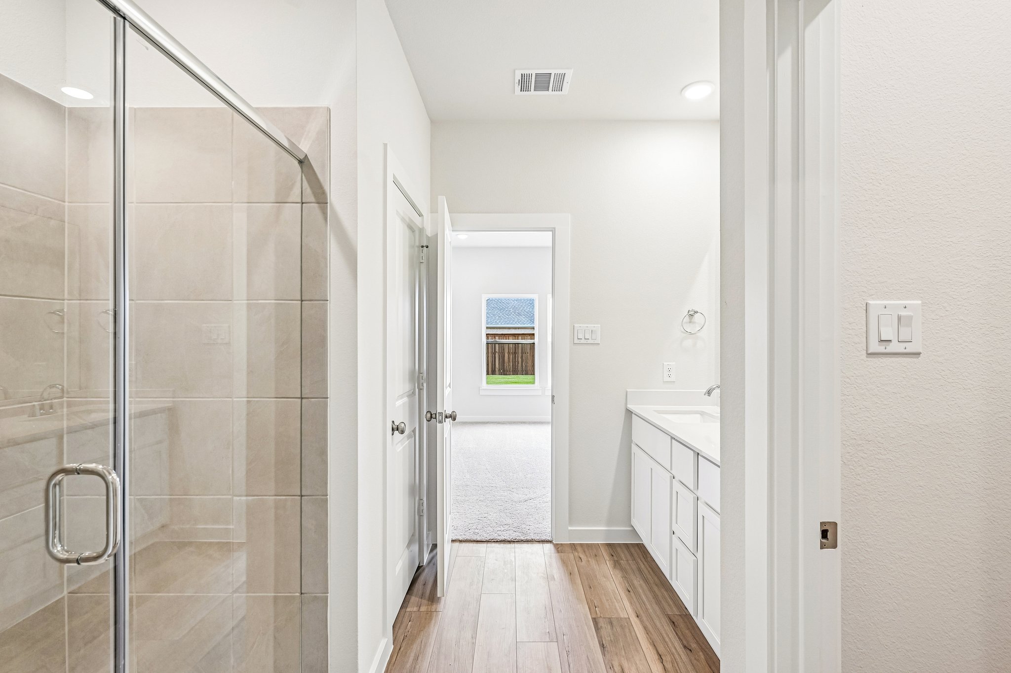 A bathroom with a glass shower.