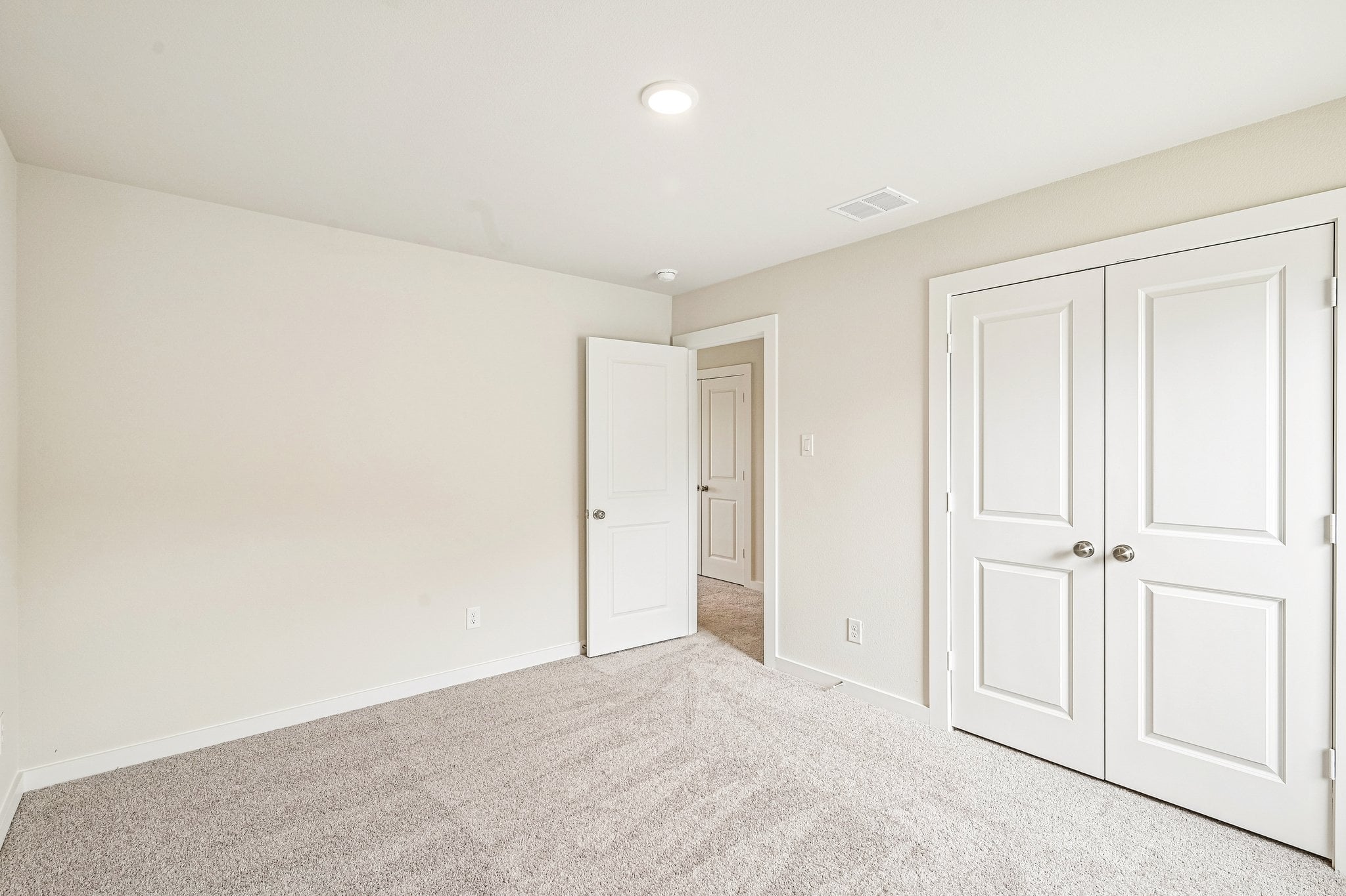 A room with white doors.