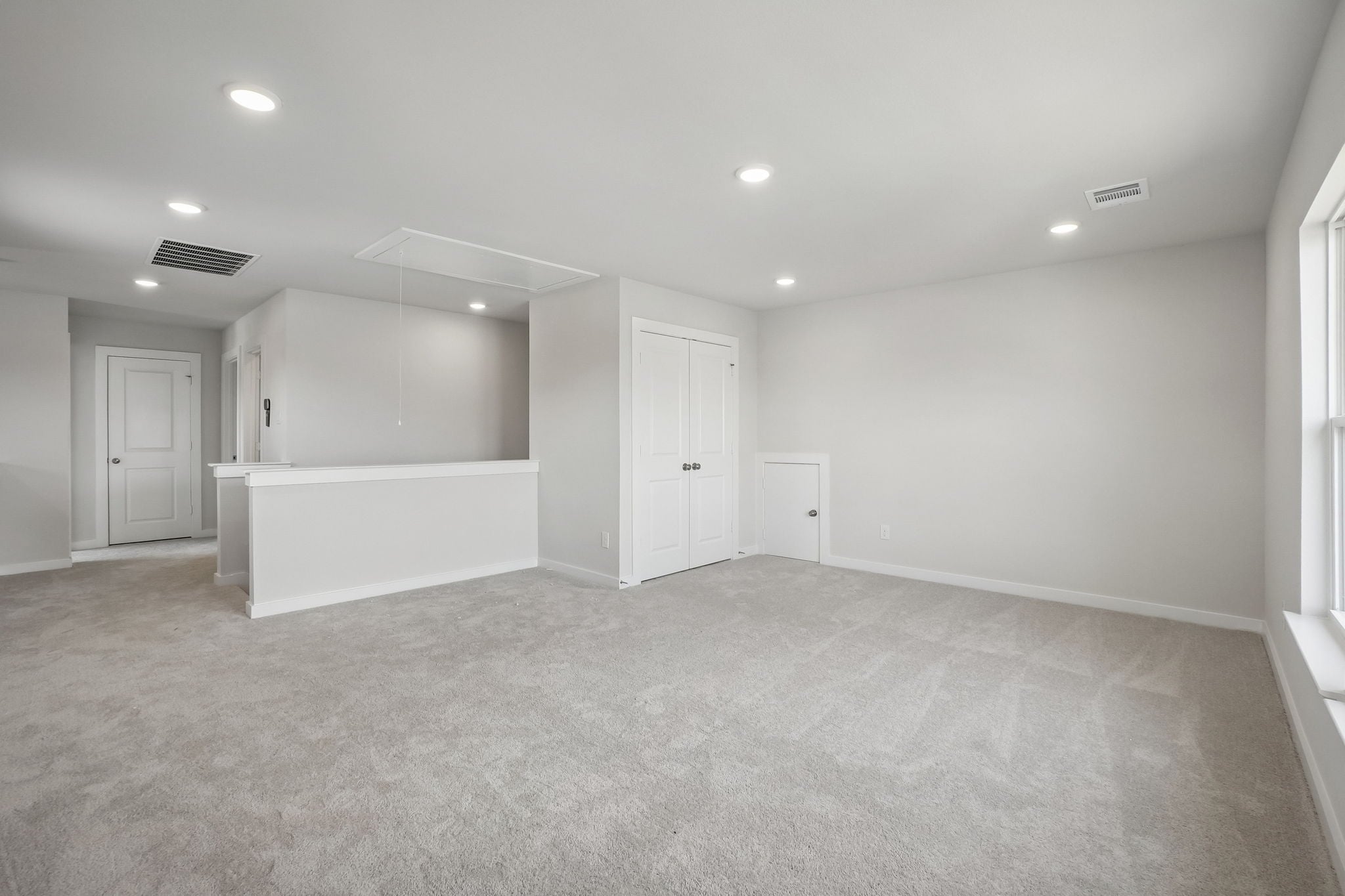 A room with white doors.