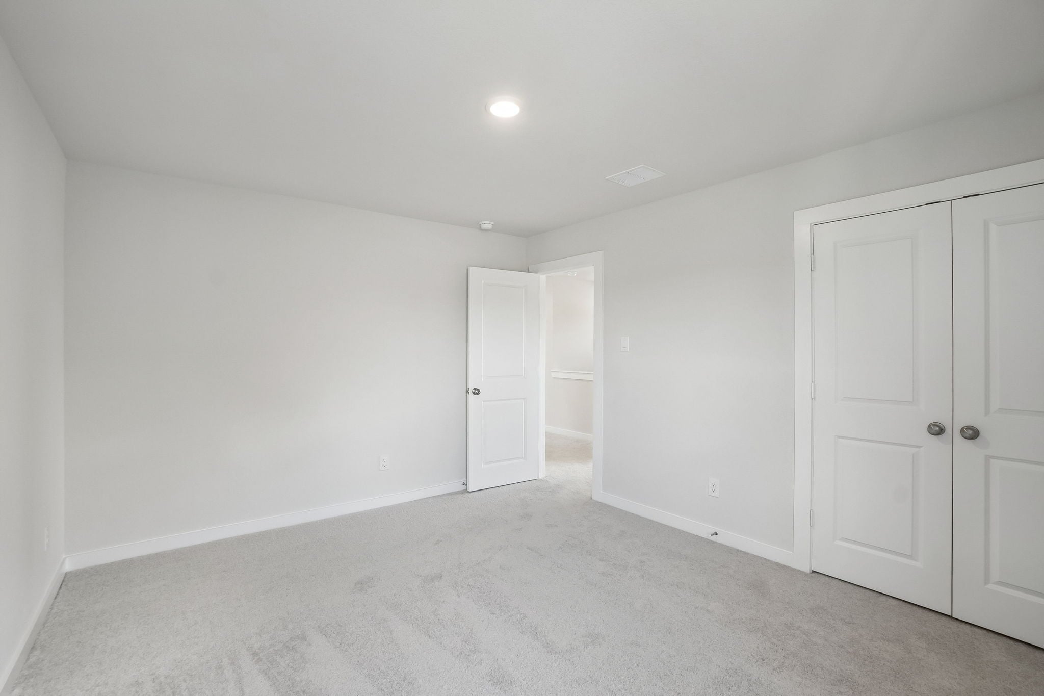A room with white doors.