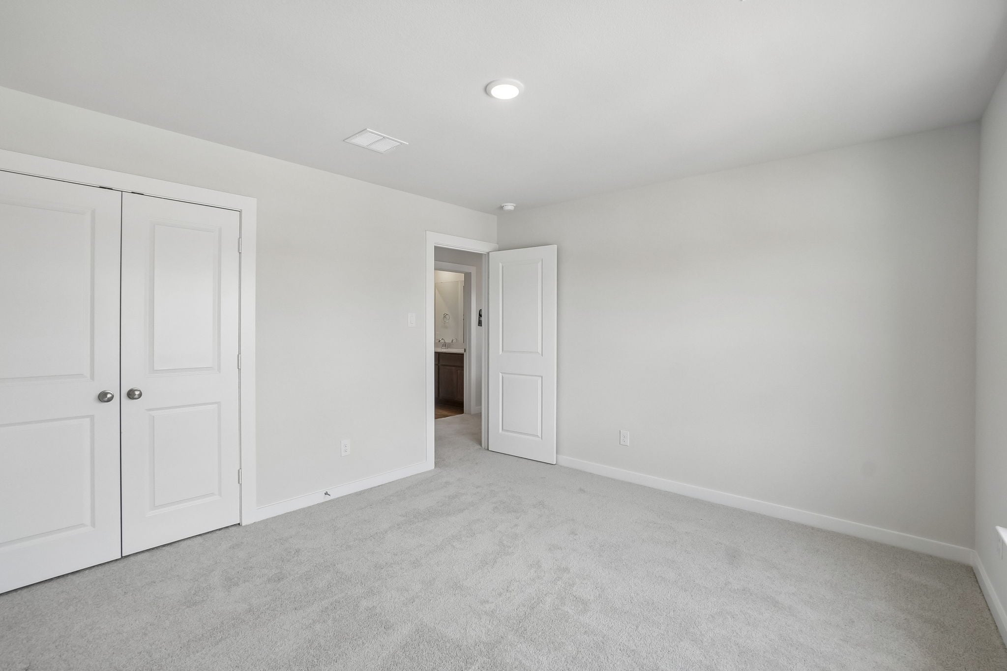A room with white doors.