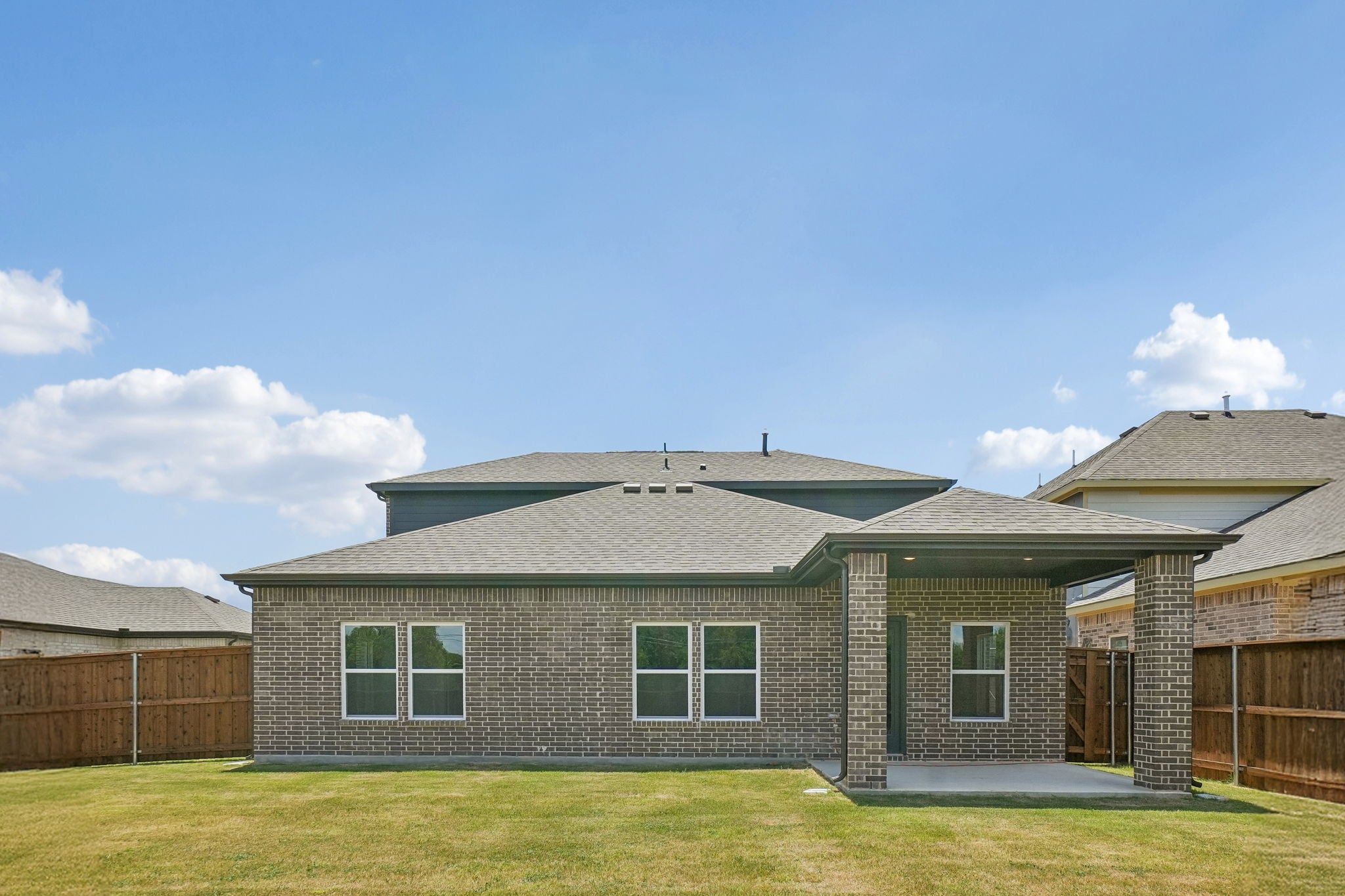 A house with a grass yard.
