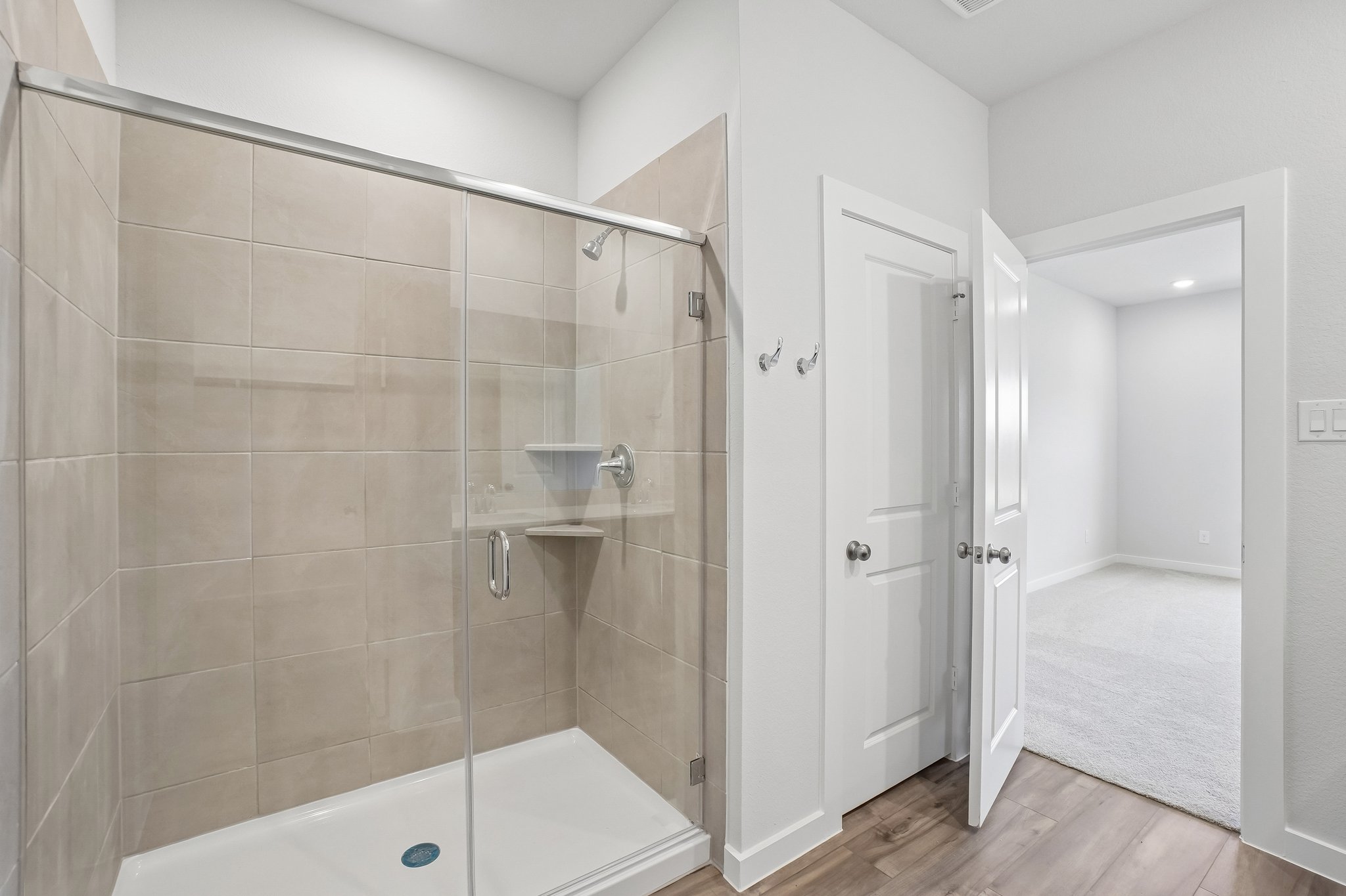 A bathroom with a glass shower.