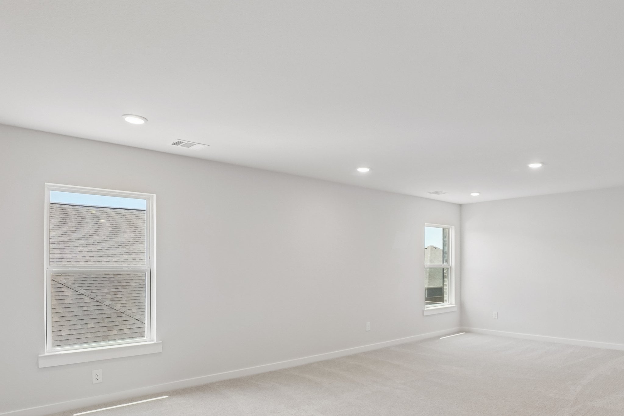 A room with a window and a door.