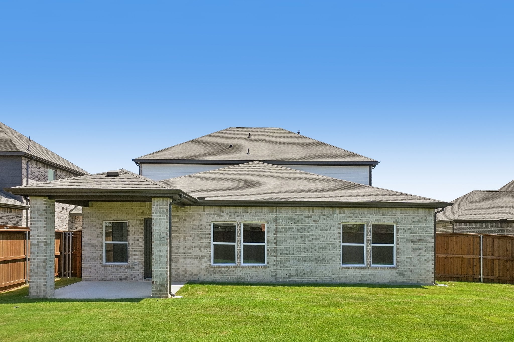 A house with a grass yard.